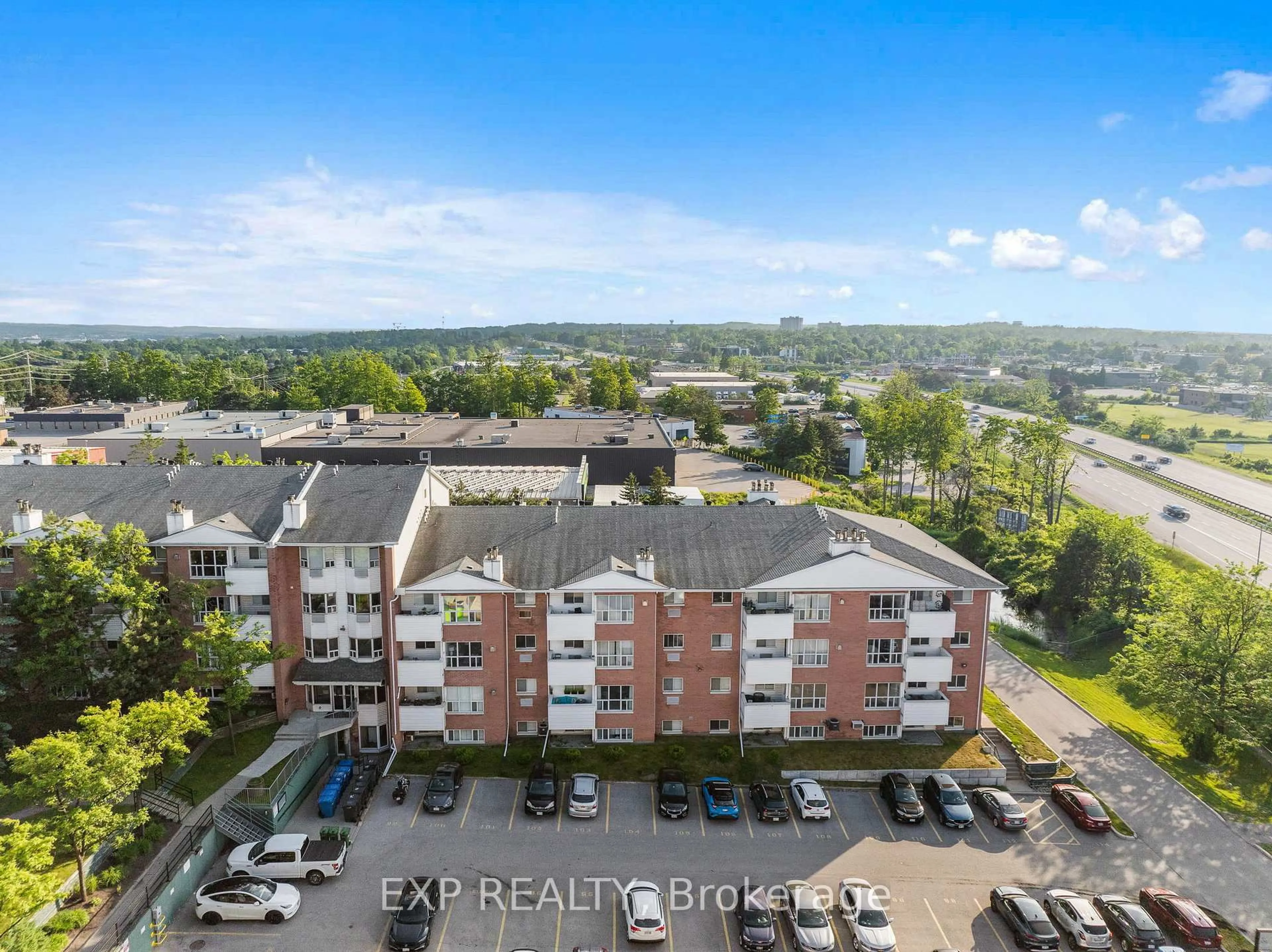 A pic from outside/outdoor area/front of a property/back of a property/a pic from drone, city buildings view from balcony for 120 Bell Farm Rd #202, Barrie Ontario L4M 6J2