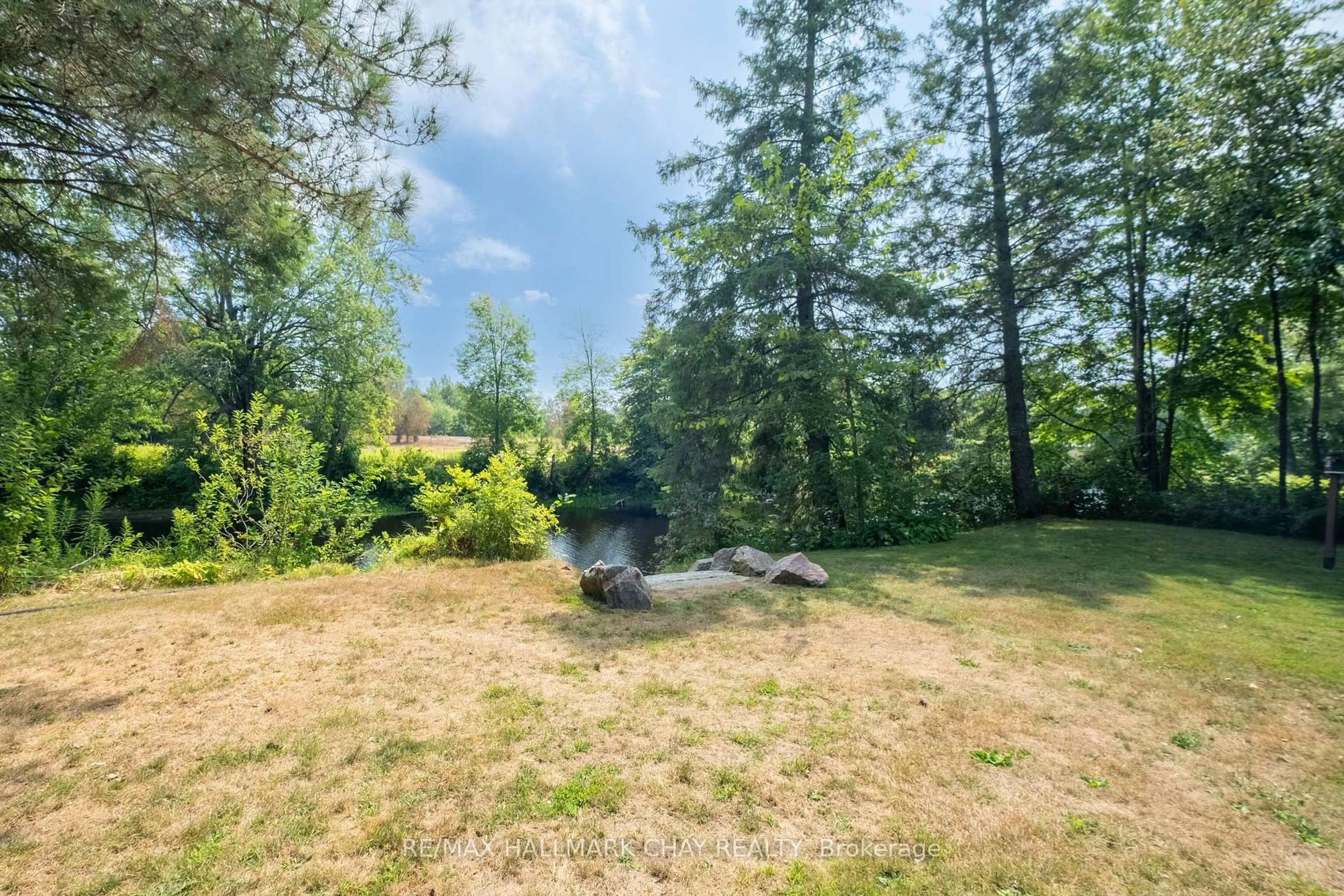 A pic from outside/outdoor area/front of a property/back of a property/a pic from drone, forest/trees view for 7249 Davy Dr, Ramara Ontario L0K 2B0