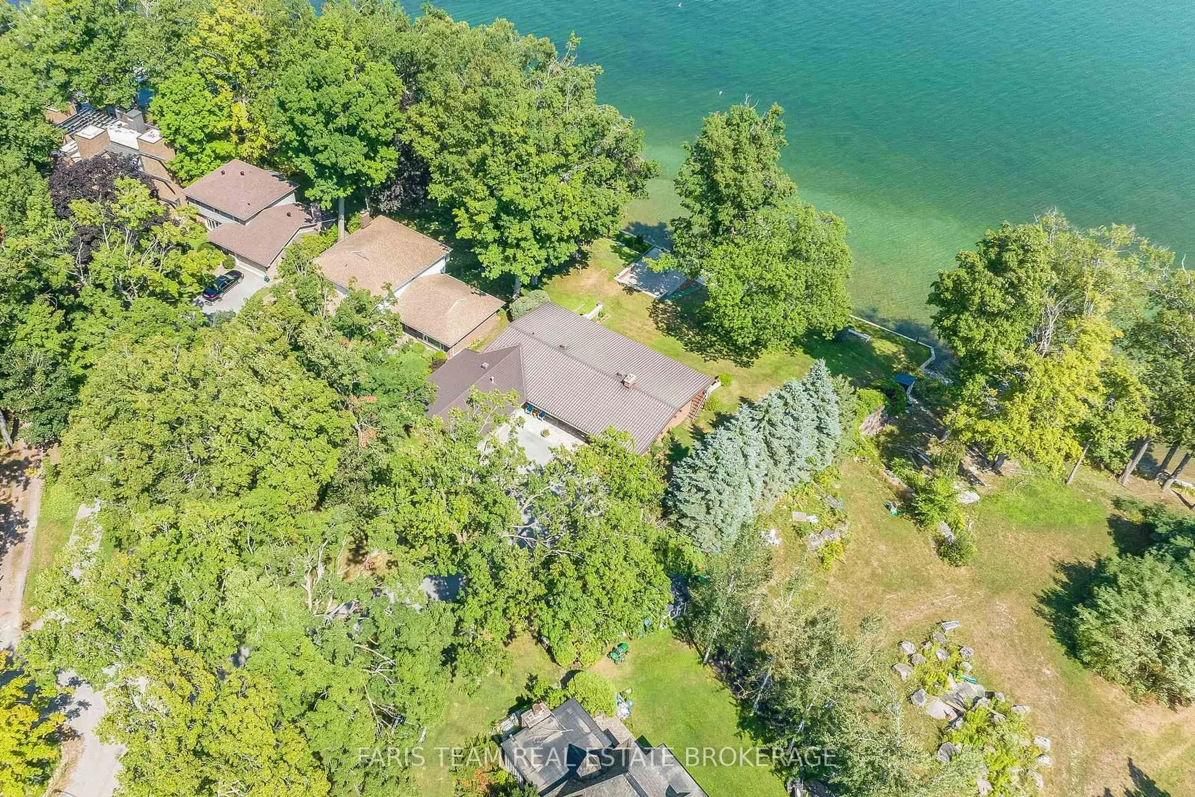 A pic from outside/outdoor area/front of a property/back of a property/a pic from drone, water/lake/river/ocean view for 1 Southwood Circ, Orillia Ontario L3V 2H8