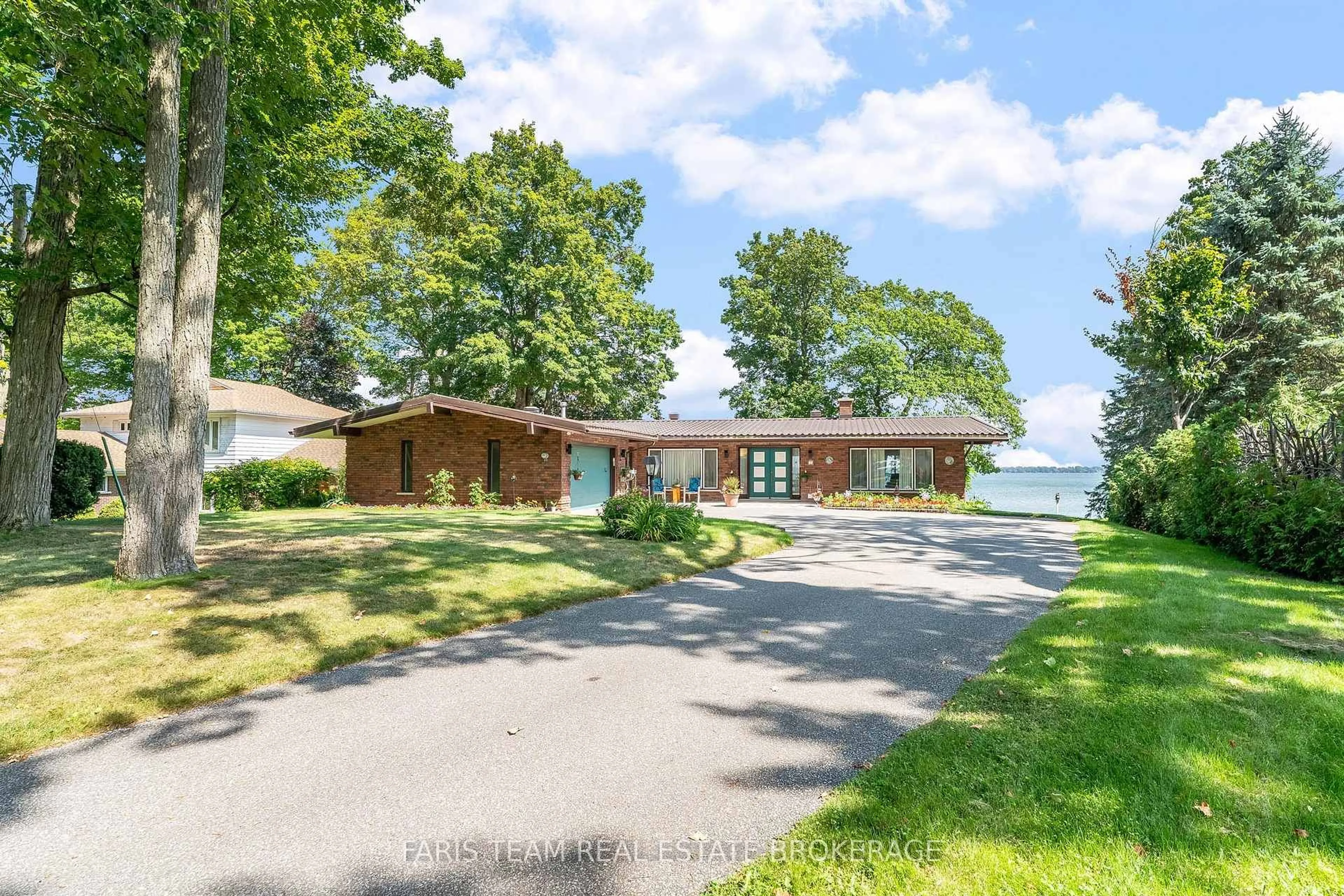 A pic from outside/outdoor area/front of a property/back of a property/a pic from drone, water/lake/river/ocean view for 1 Southwood Circ, Orillia Ontario L3V 2H8