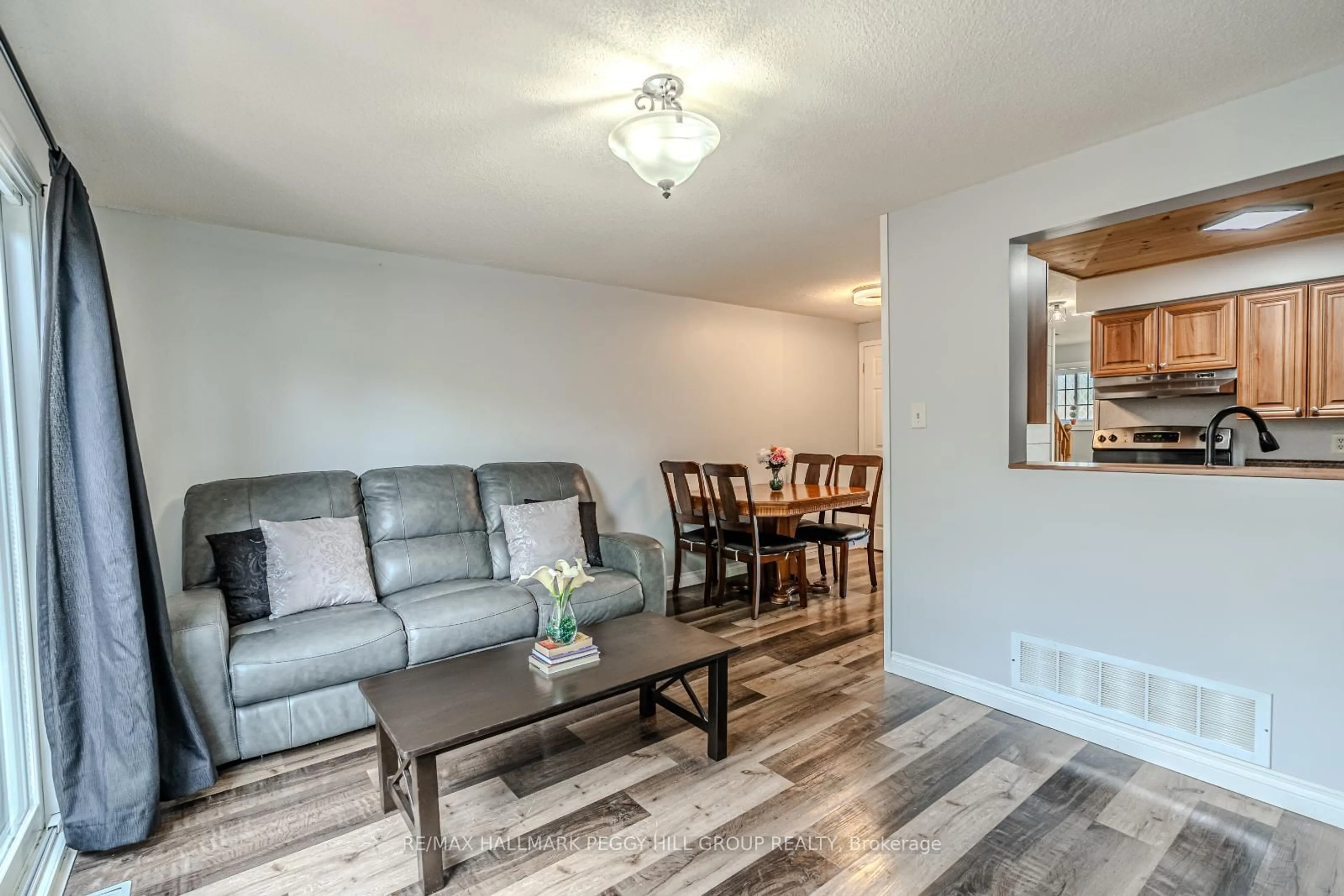 Living room with furniture, wood/laminate floor for 193 Nathan Cres, Barrie Ontario L4N 0S4
