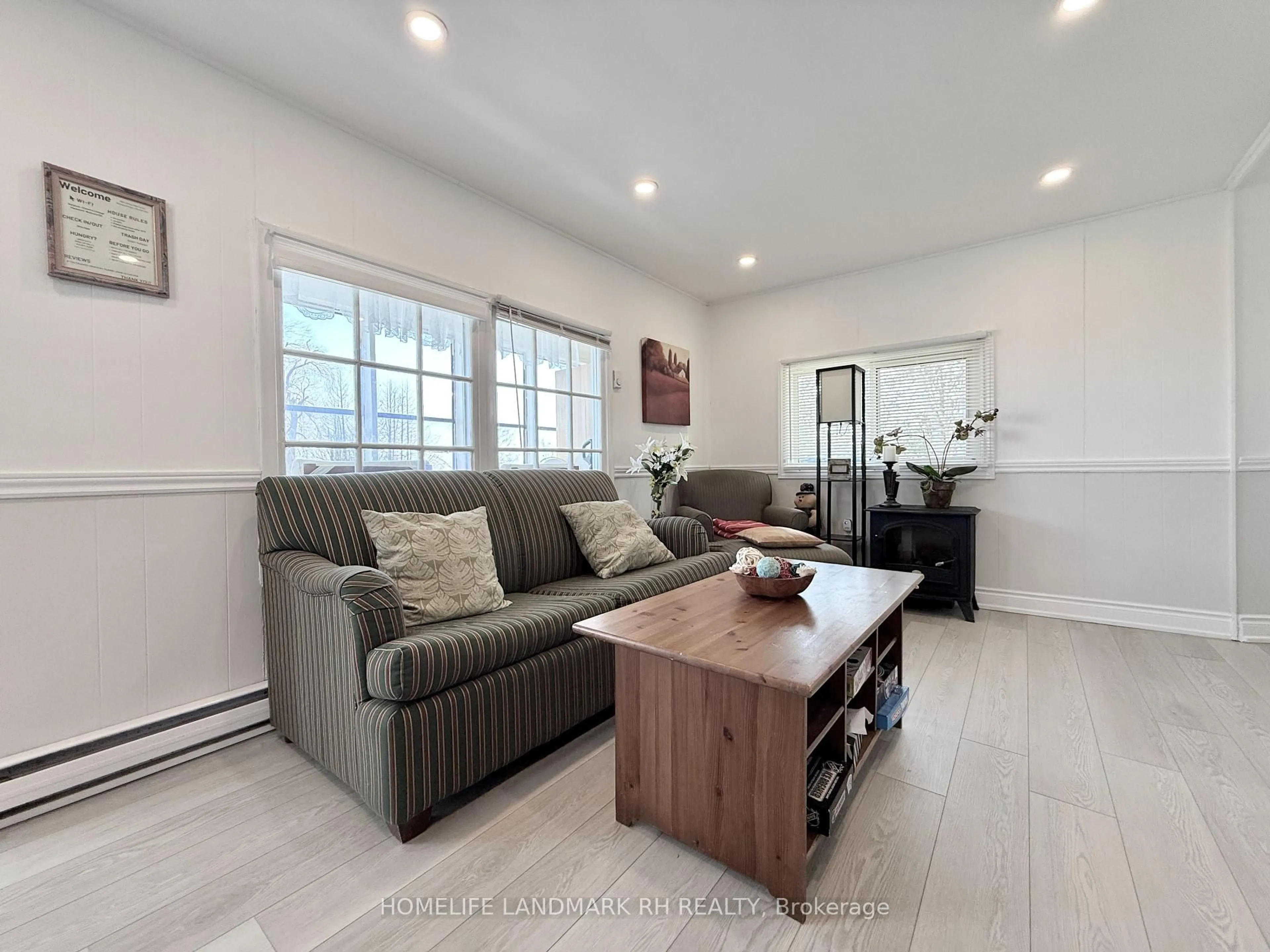 Living room with furniture, wood/laminate floor for 1654 Viking Marina Rd, Severn Ontario L0K 2C0