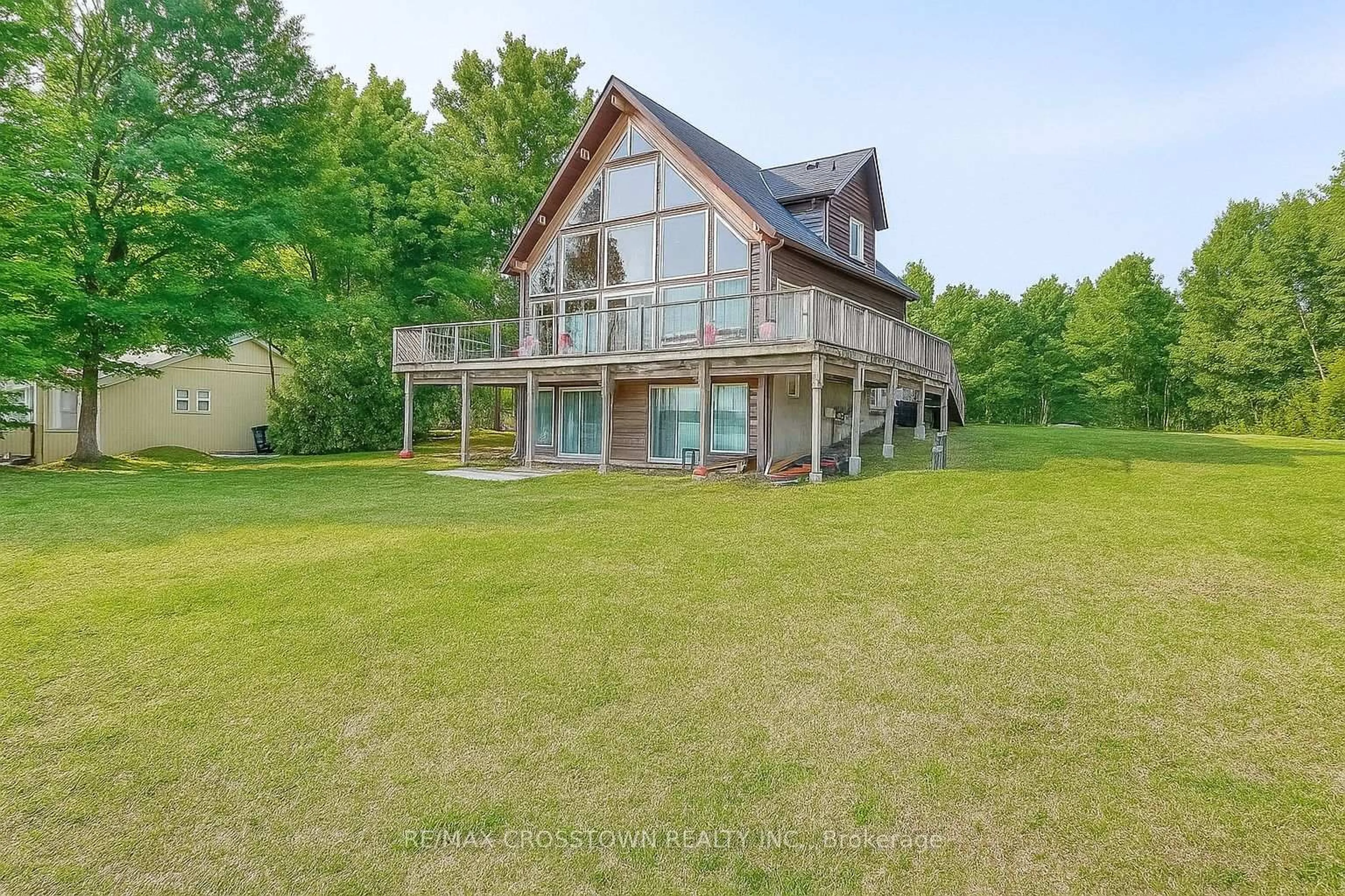 A pic from outside/outdoor area/front of a property/back of a property/a pic from drone, water/lake/river/ocean view for 3093 Sandy Bend, Springwater Ontario L0L 1P0