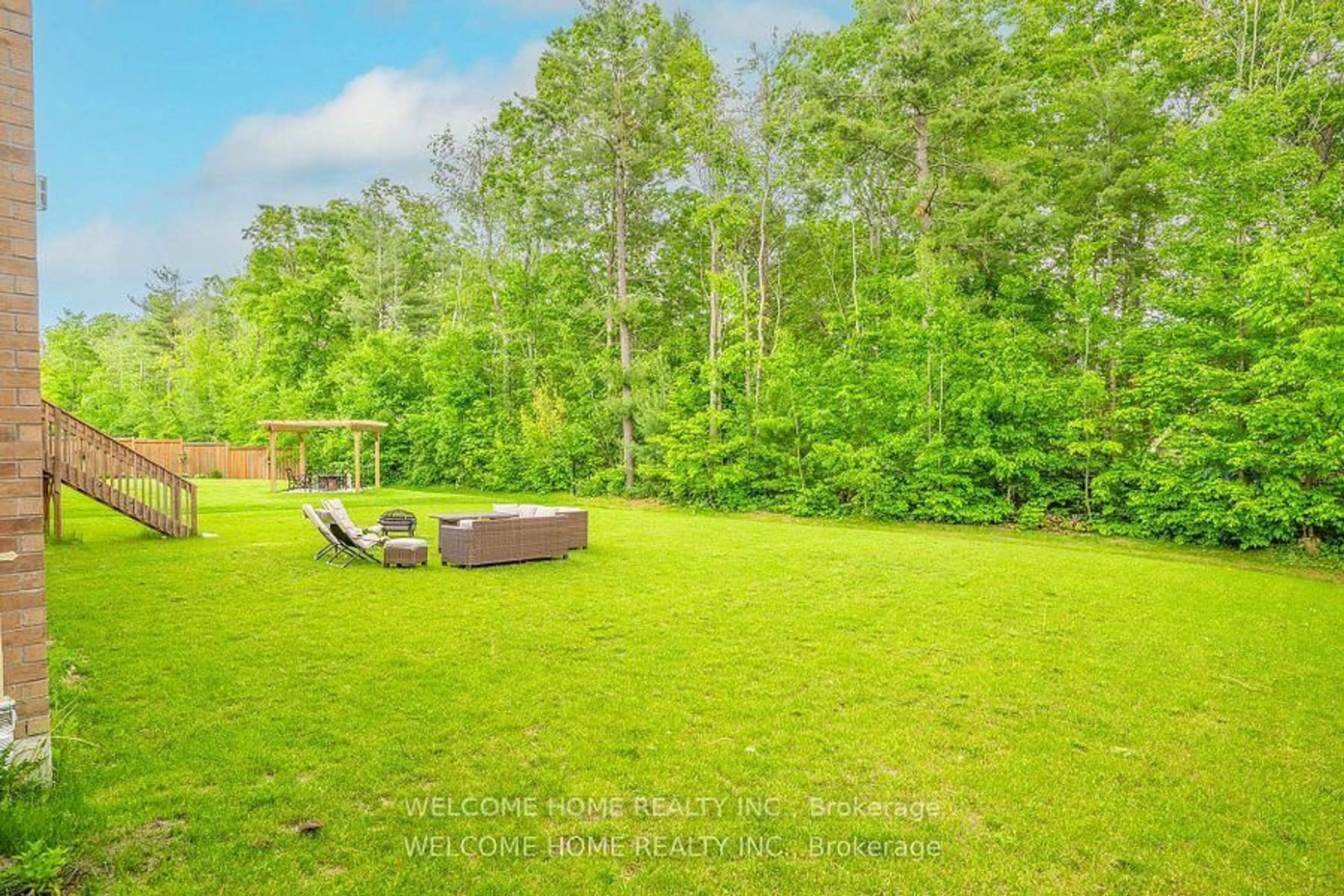 Patio, forest/trees view for 65 Redmond Cres, Springwater Ontario L9X 1Z8