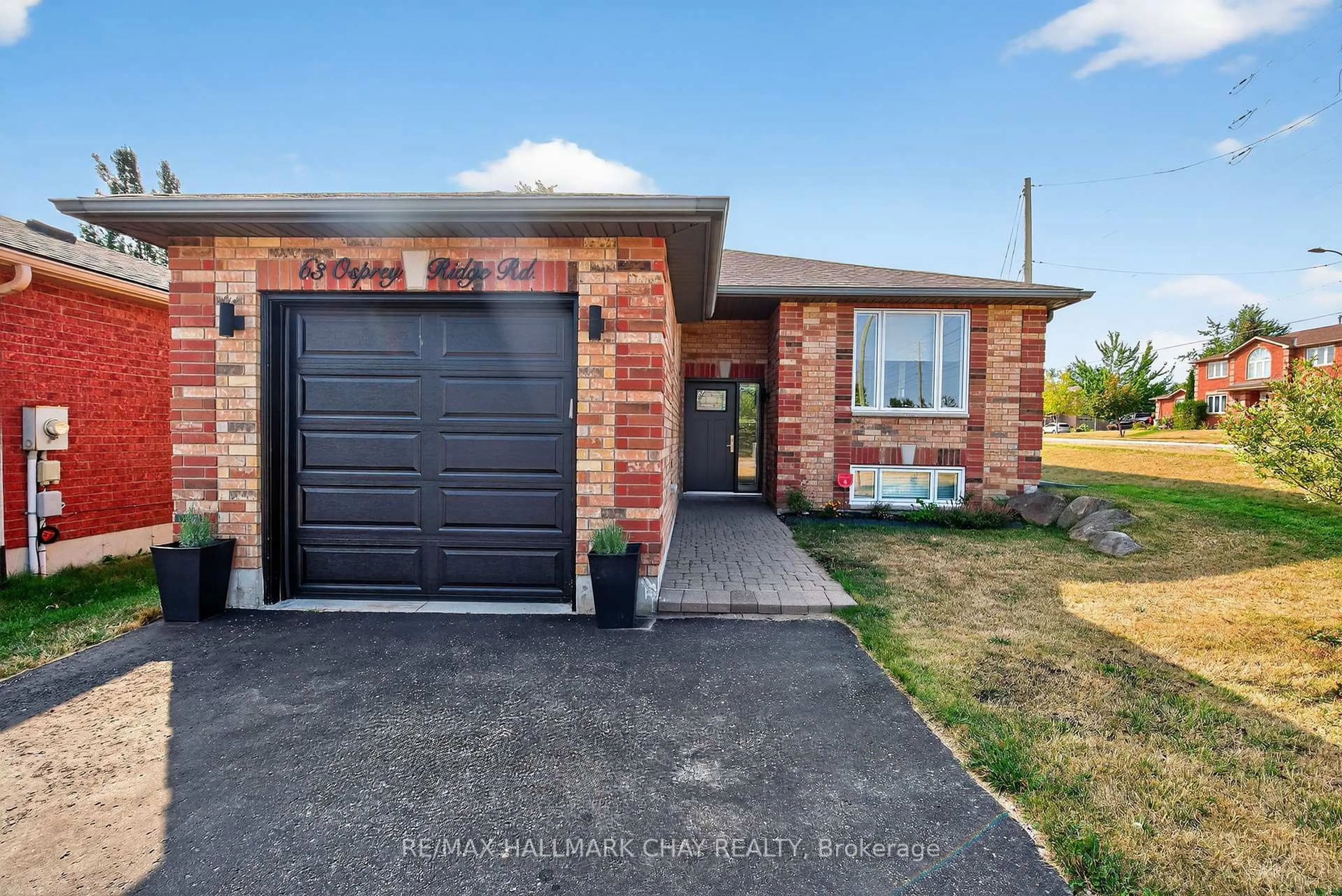 Home with brick exterior material, street for 63 Osprey Ridge Rd, Barrie Ontario L4M 6P3