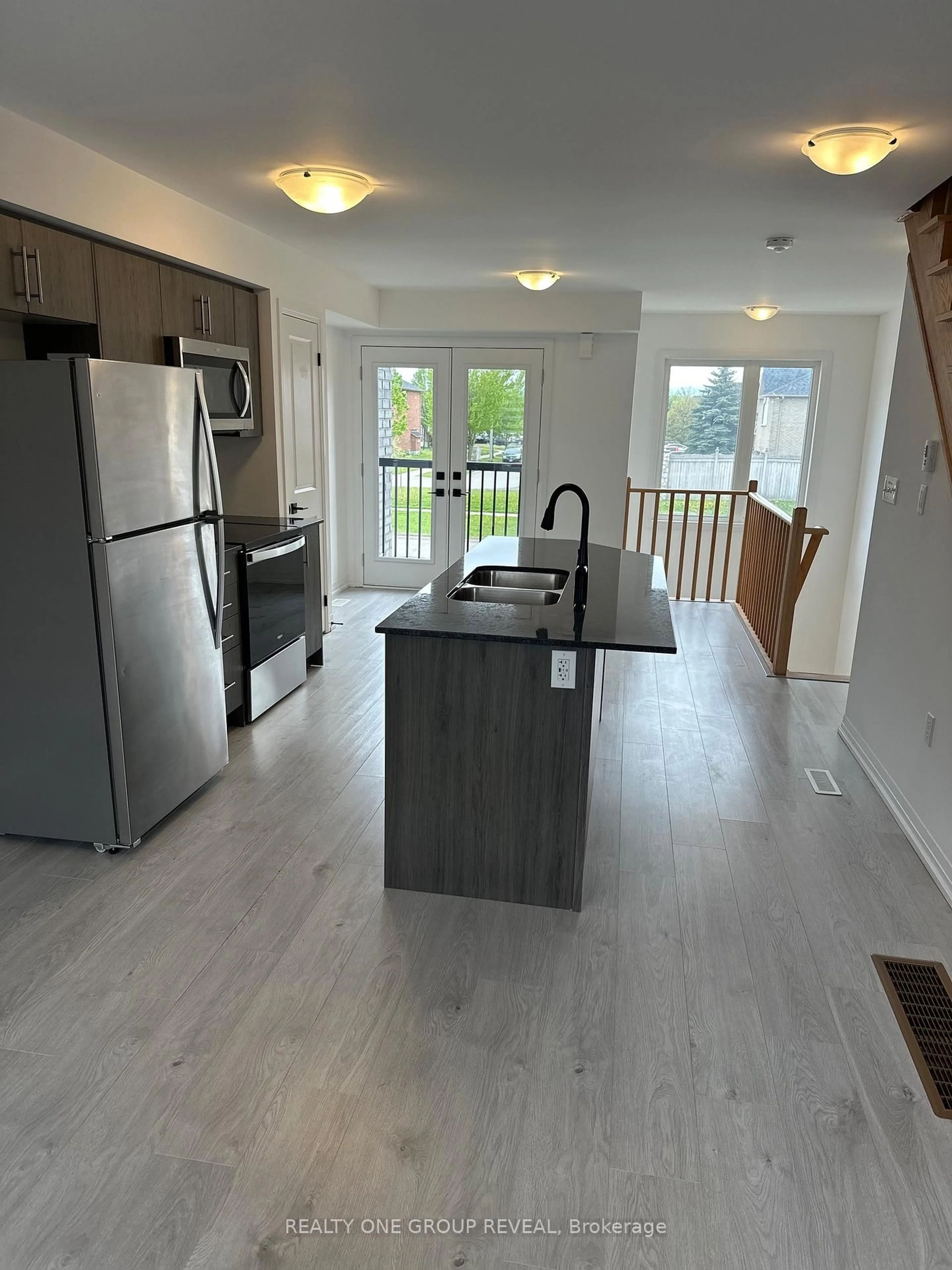 Open concept kitchen, wood/laminate floor for 67 Fairlane Ave, Barrie Ontario L9J 0N1