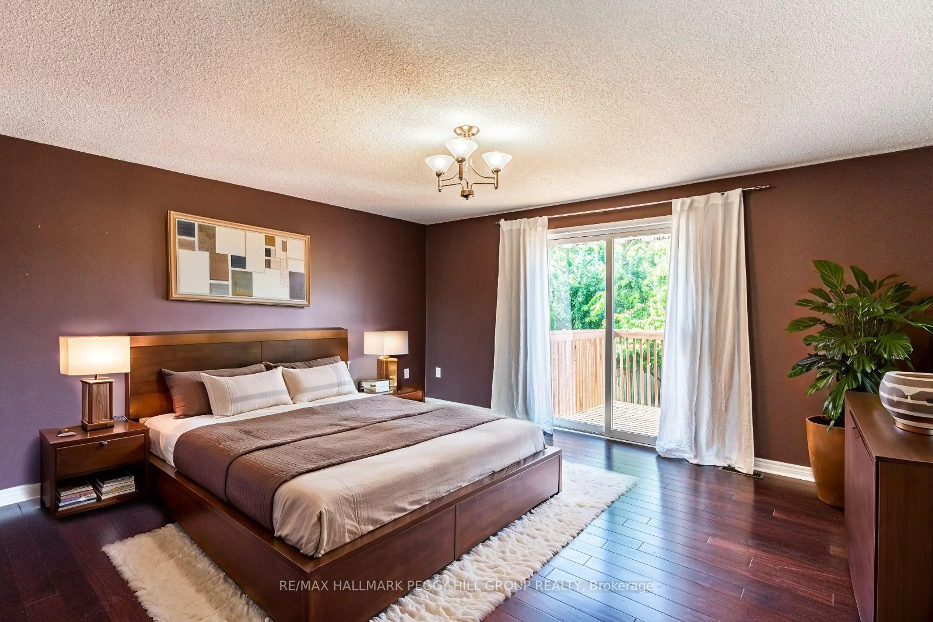 Bedroom with bed, wood/laminate floor for 261 Mapleton Ave, Barrie Ontario L4N 8T3
