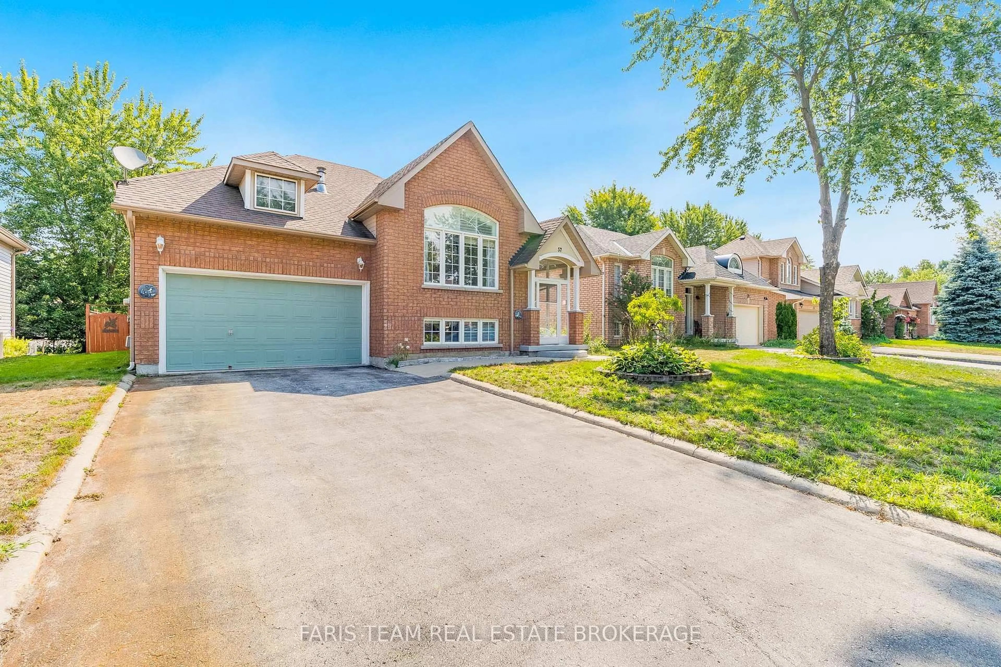 Home with brick exterior material, street for 57 Rose Valley Way, Wasaga Beach Ontario L9Z 3C4