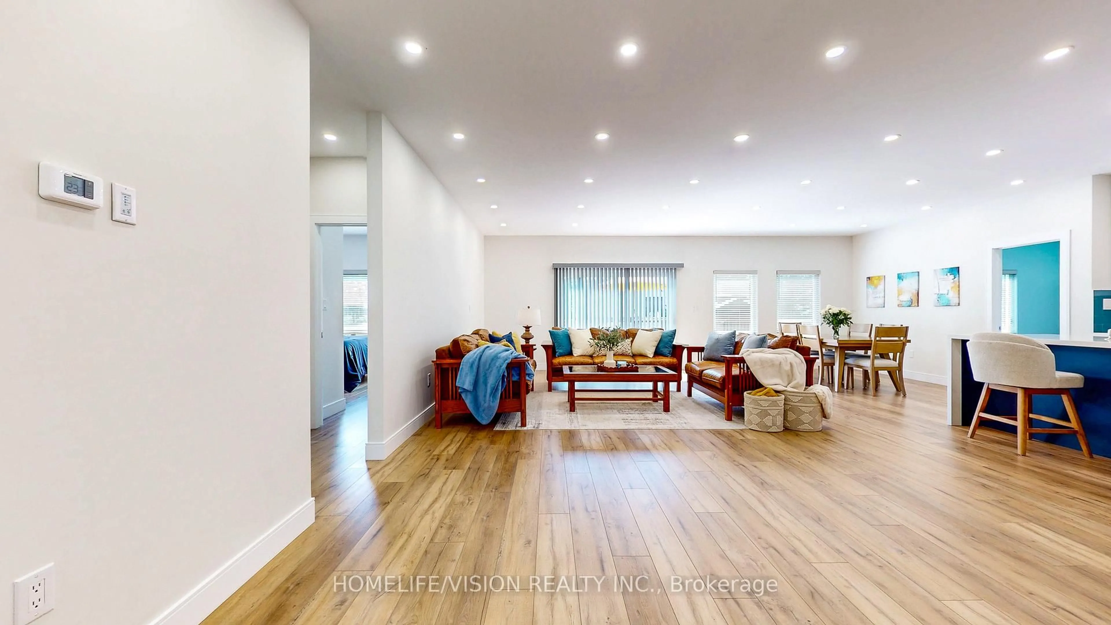 Living room with furniture, wood/laminate floor for 740 Midland Ave, Tay Ontario L0K 1R0