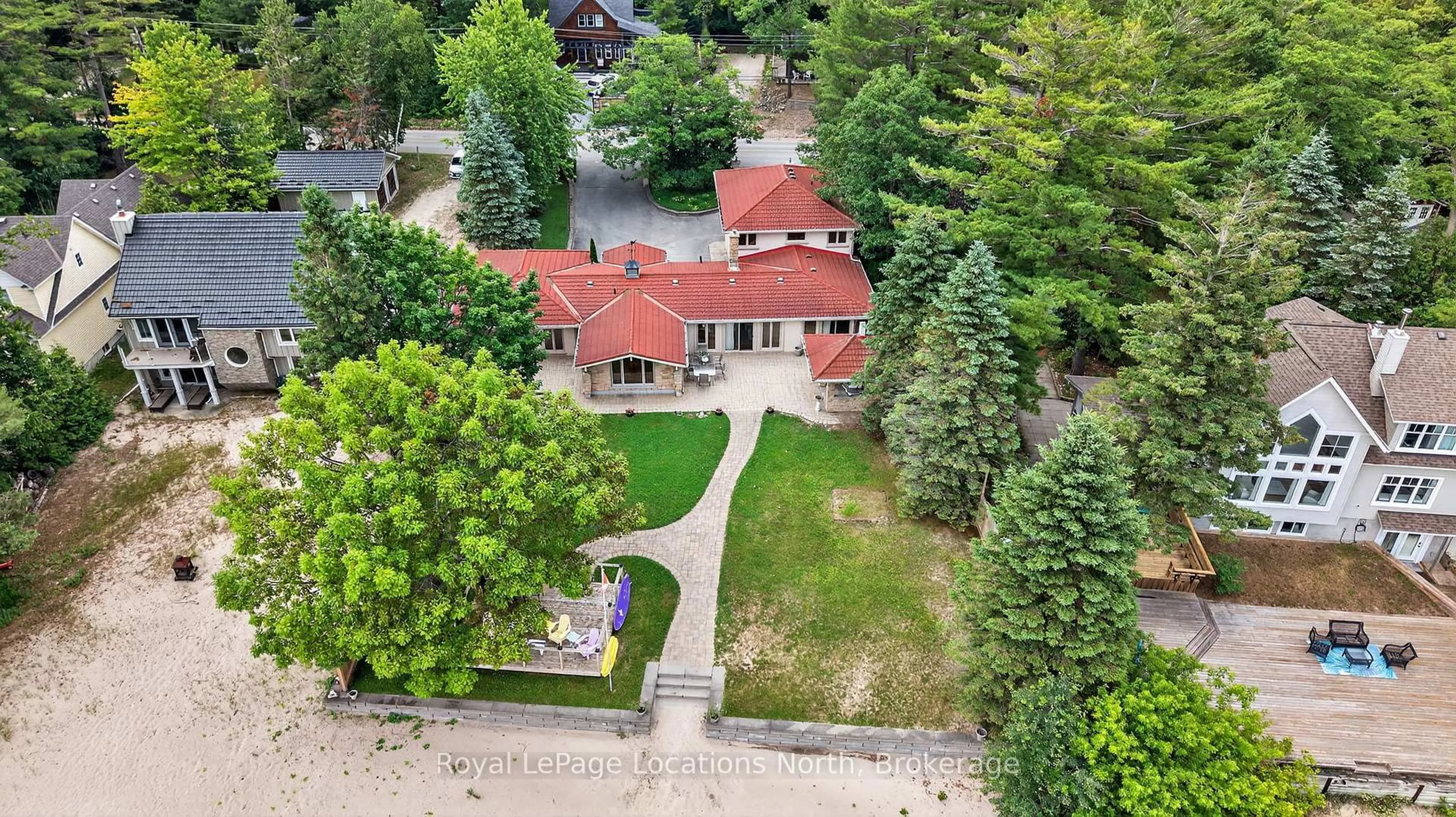 A pic from outside/outdoor area/front of a property/back of a property/a pic from drone, street for 1350 River Rd, Wasaga Beach Ontario L9Z 2R9