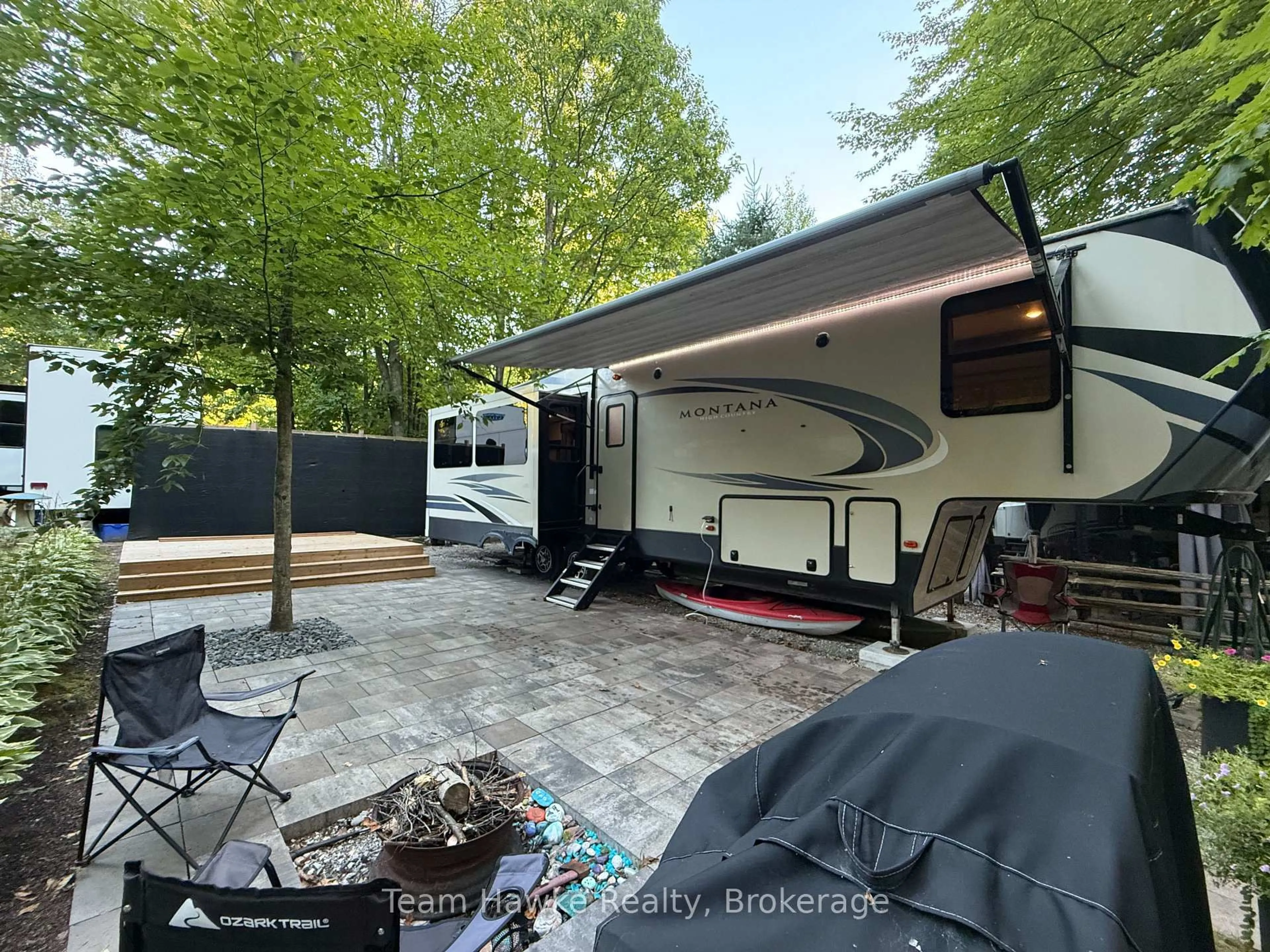 Patio, forest/trees view for 2920 Old Penetanguishene Rd #104, Springwater Ontario L0L 1P0