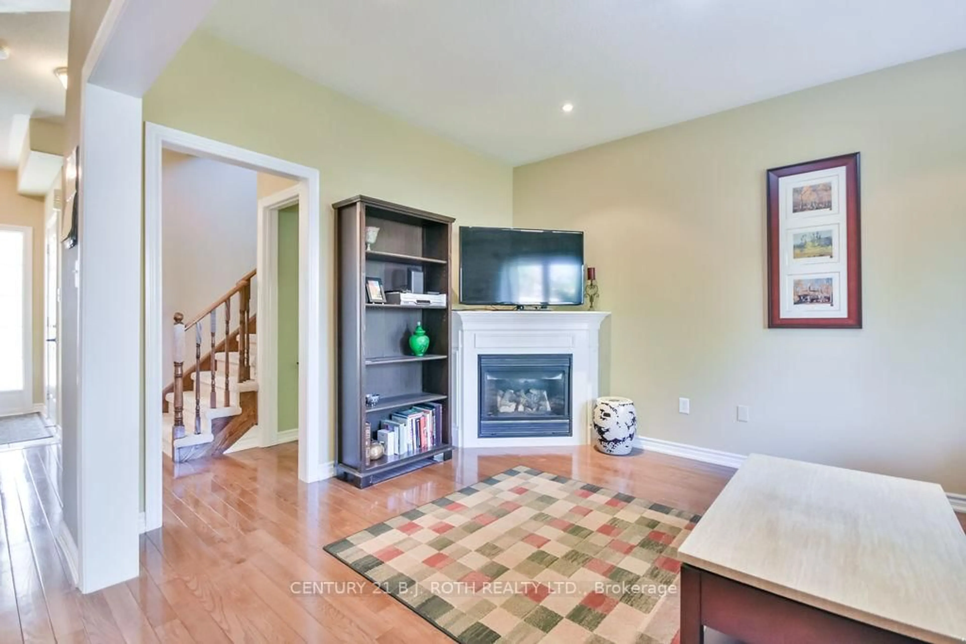 Living room with furniture, wood/laminate floor for 5 Stuart Ave, Barrie Ontario L4M 0A1