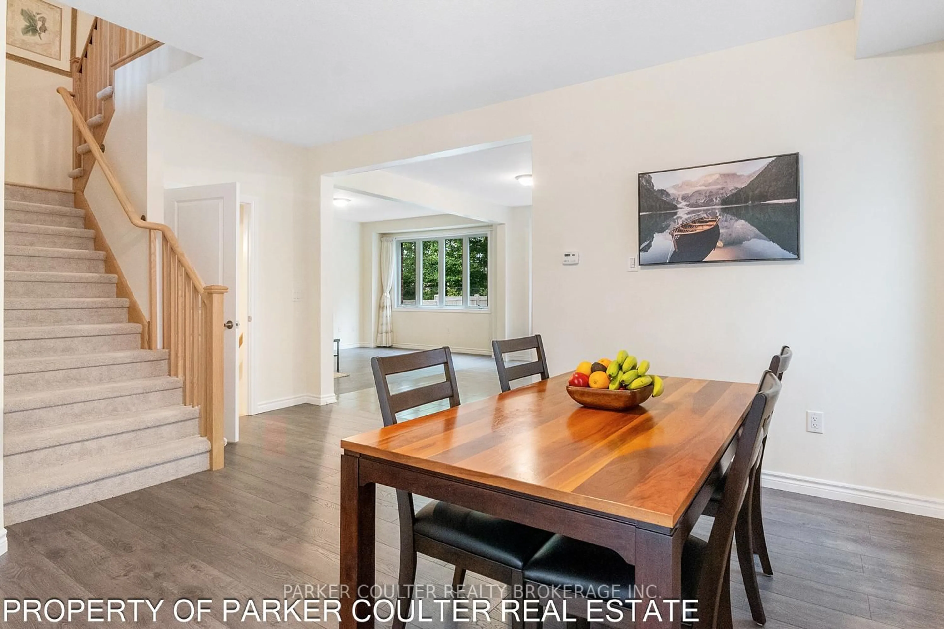 Open concept kitchen, wood/laminate floor for 35 Atlantis Dr, Orillia Ontario L3V 8L4