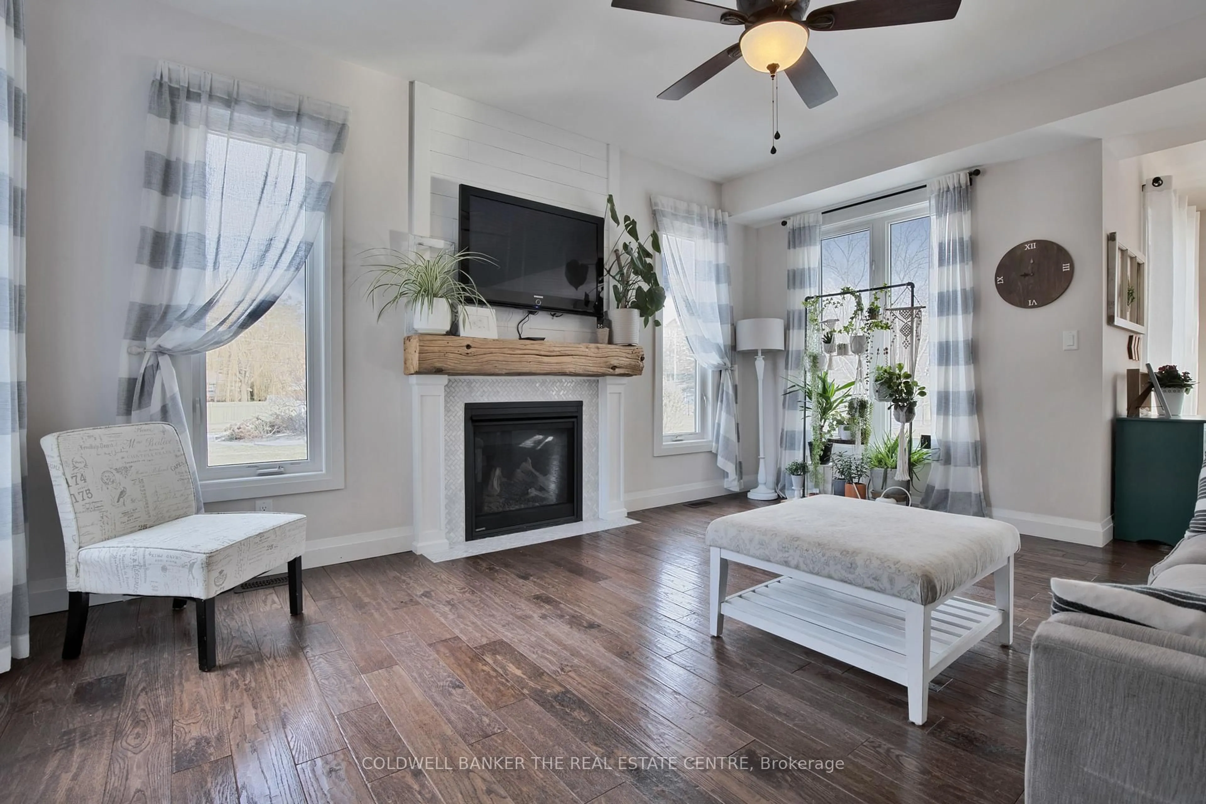 Living room with furniture, wood/laminate floor for 202 Clarence St, Clearview Ontario L0M 1S0