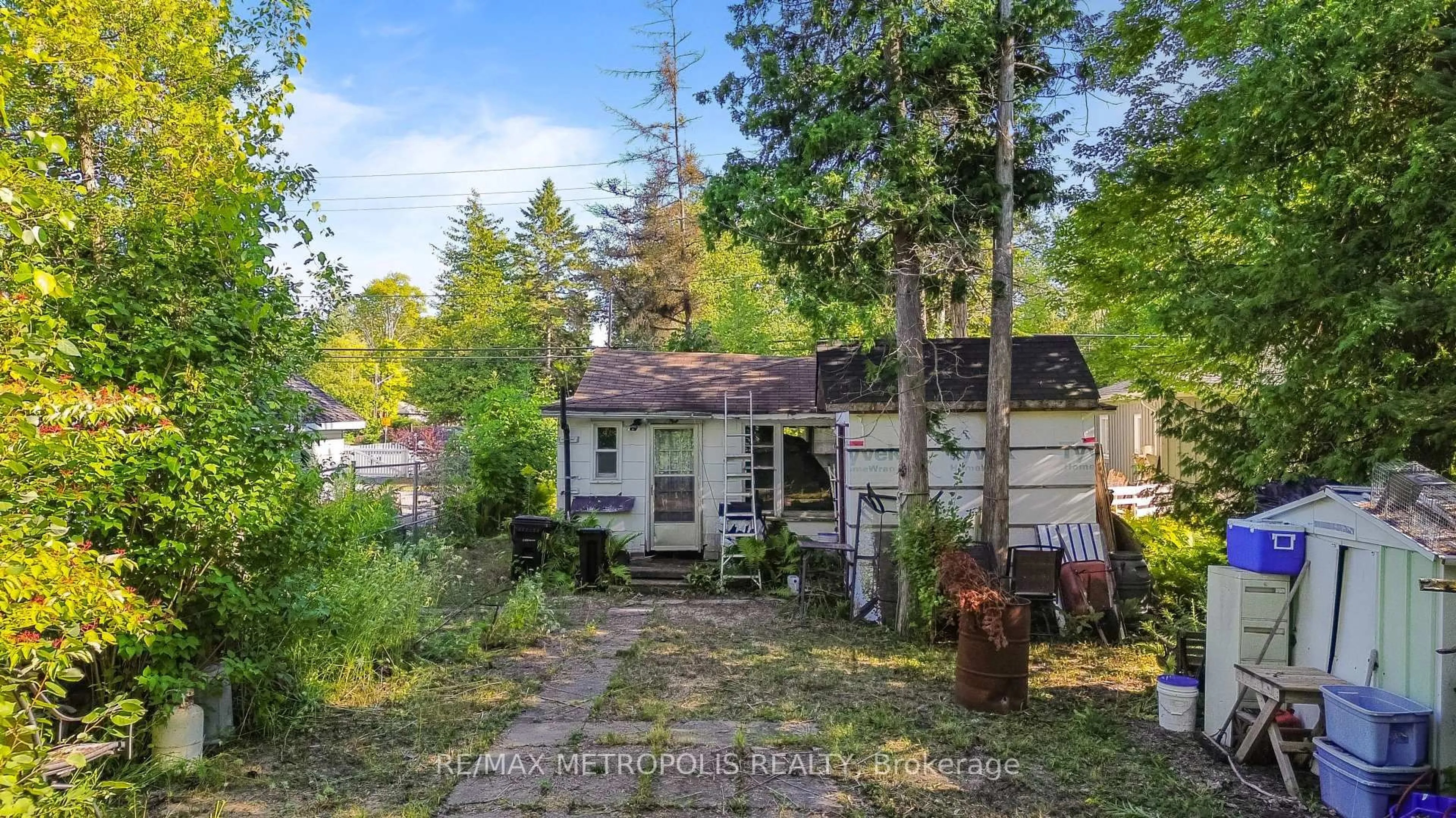 A pic from outside/outdoor area/front of a property/back of a property/a pic from drone, forest/trees view for 3126 Mosley St, Wasaga Beach Ontario L9Z 1V6