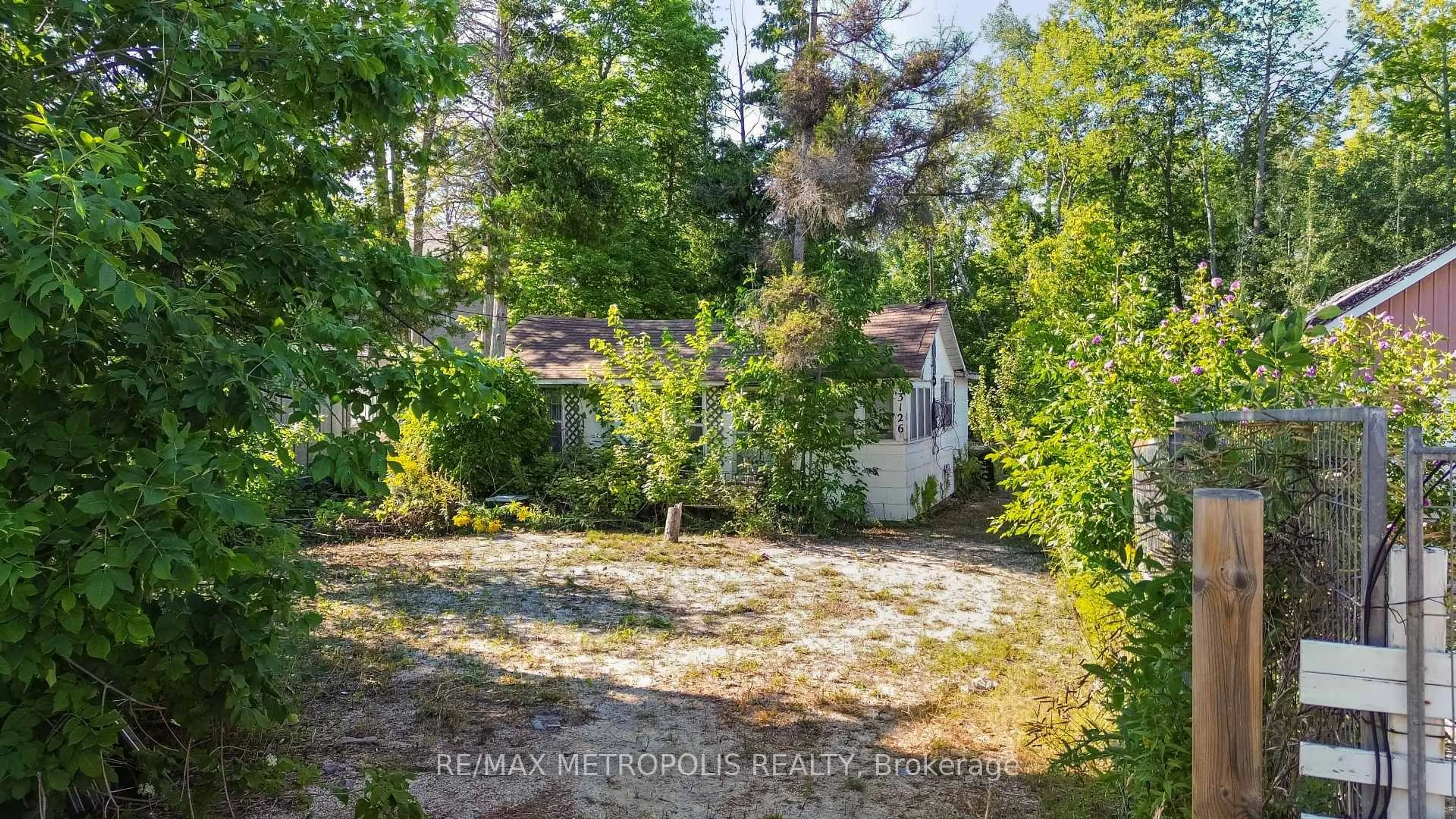 A pic from outside/outdoor area/front of a property/back of a property/a pic from drone, forest/trees view for 3126 Mosley St, Wasaga Beach Ontario L9Z 1V6