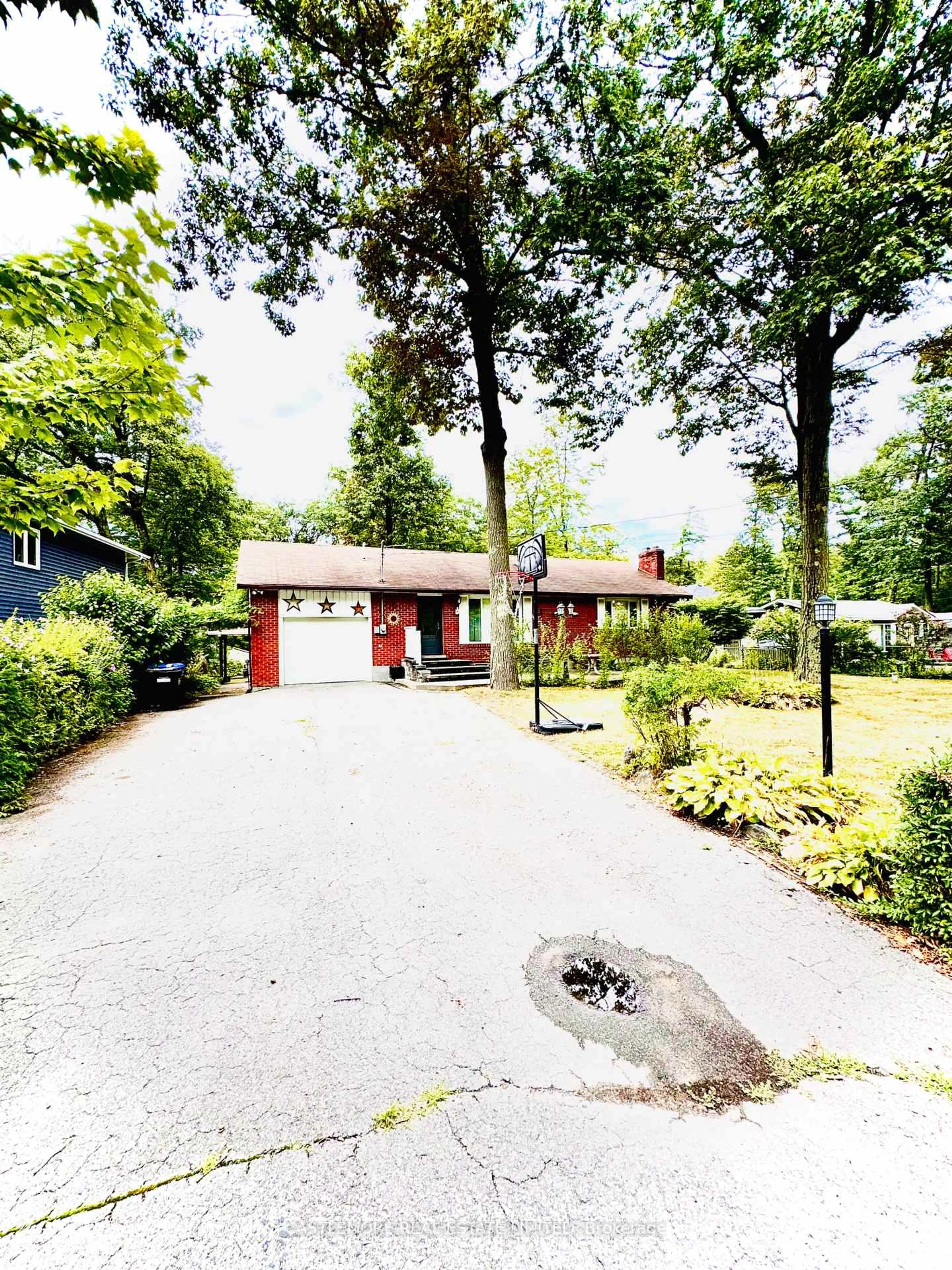 A pic from outside/outdoor area/front of a property/back of a property/a pic from drone, street for 10 Cabell Rd, Tiny Ontario L0L 1P0