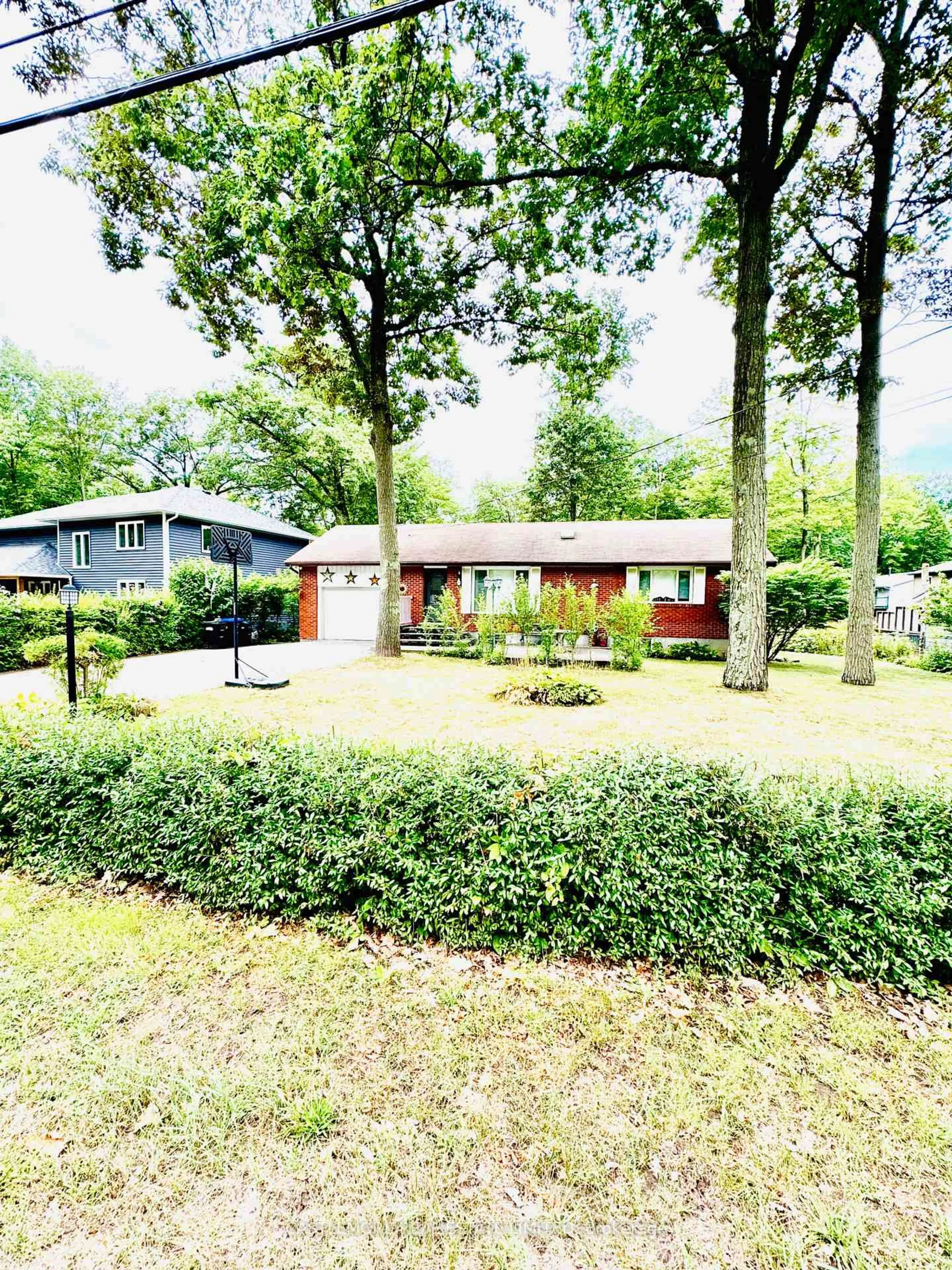 A pic from outside/outdoor area/front of a property/back of a property/a pic from drone, street for 10 Cabell Rd, Tiny Ontario L0L 1P0