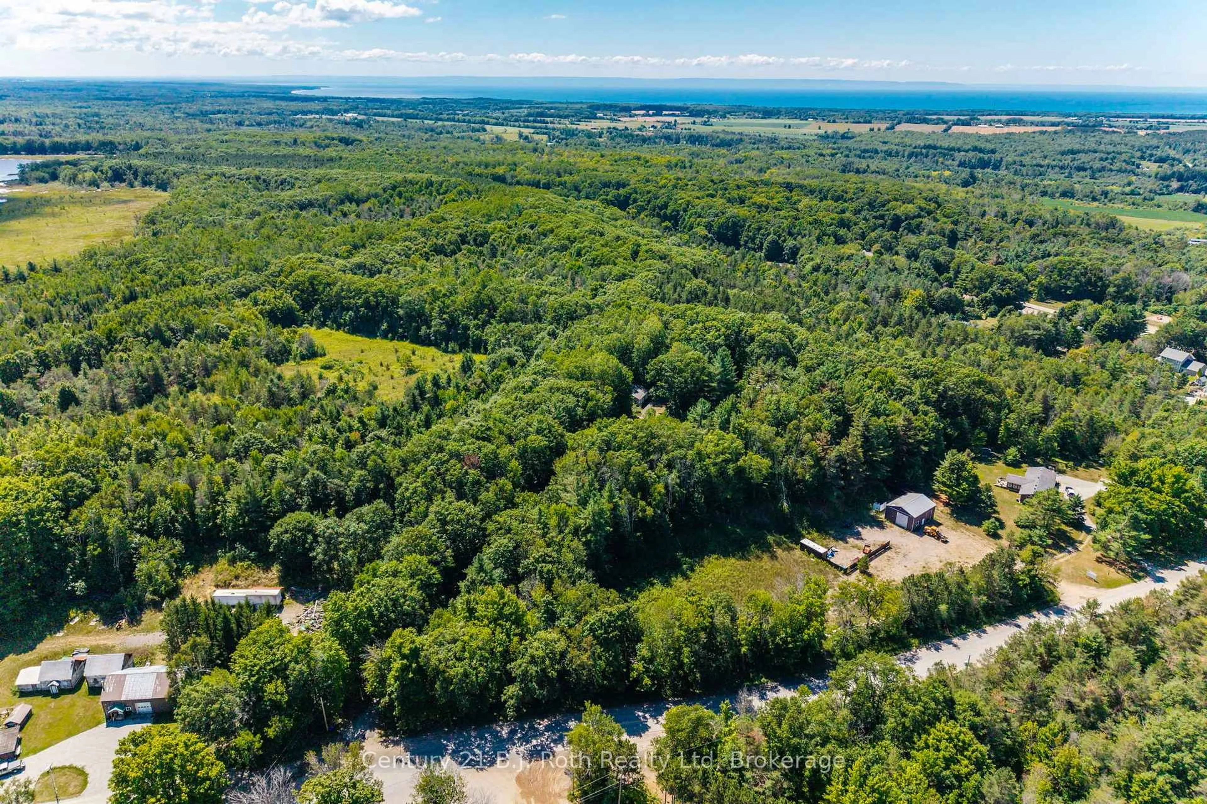 A pic from outside/outdoor area/front of a property/back of a property/a pic from drone, forest/trees view for 1749 Golf Link Rd, Tiny Ontario L0L 2J0