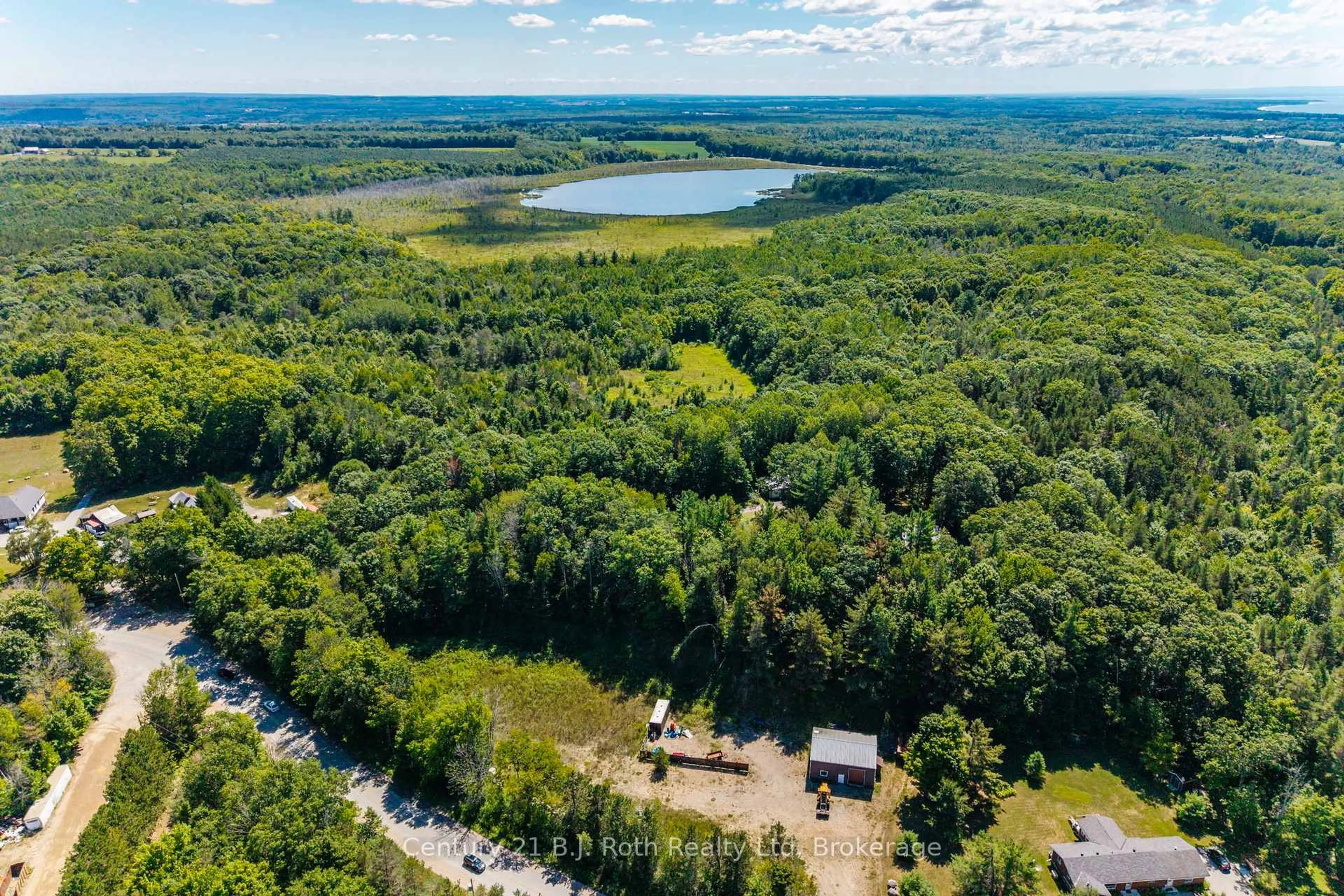 A pic from outside/outdoor area/front of a property/back of a property/a pic from drone, forest/trees view for 1749 Golf Link Rd, Tiny Ontario L0L 2J0