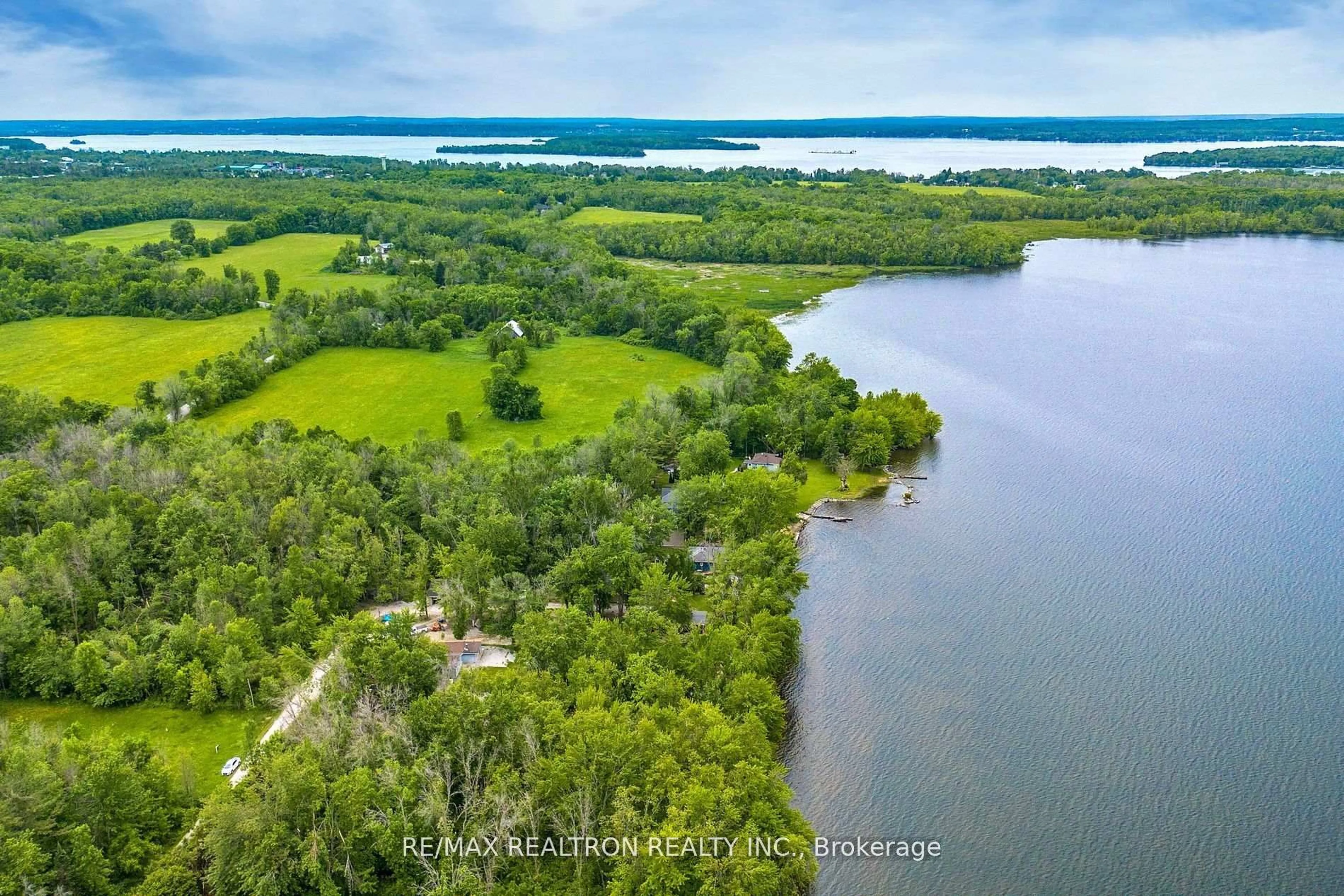 A pic from outside/outdoor area/front of a property/back of a property/a pic from drone, water/lake/river/ocean view for 6090 Sheba Dr, Ramara Ontario L3V 6H3