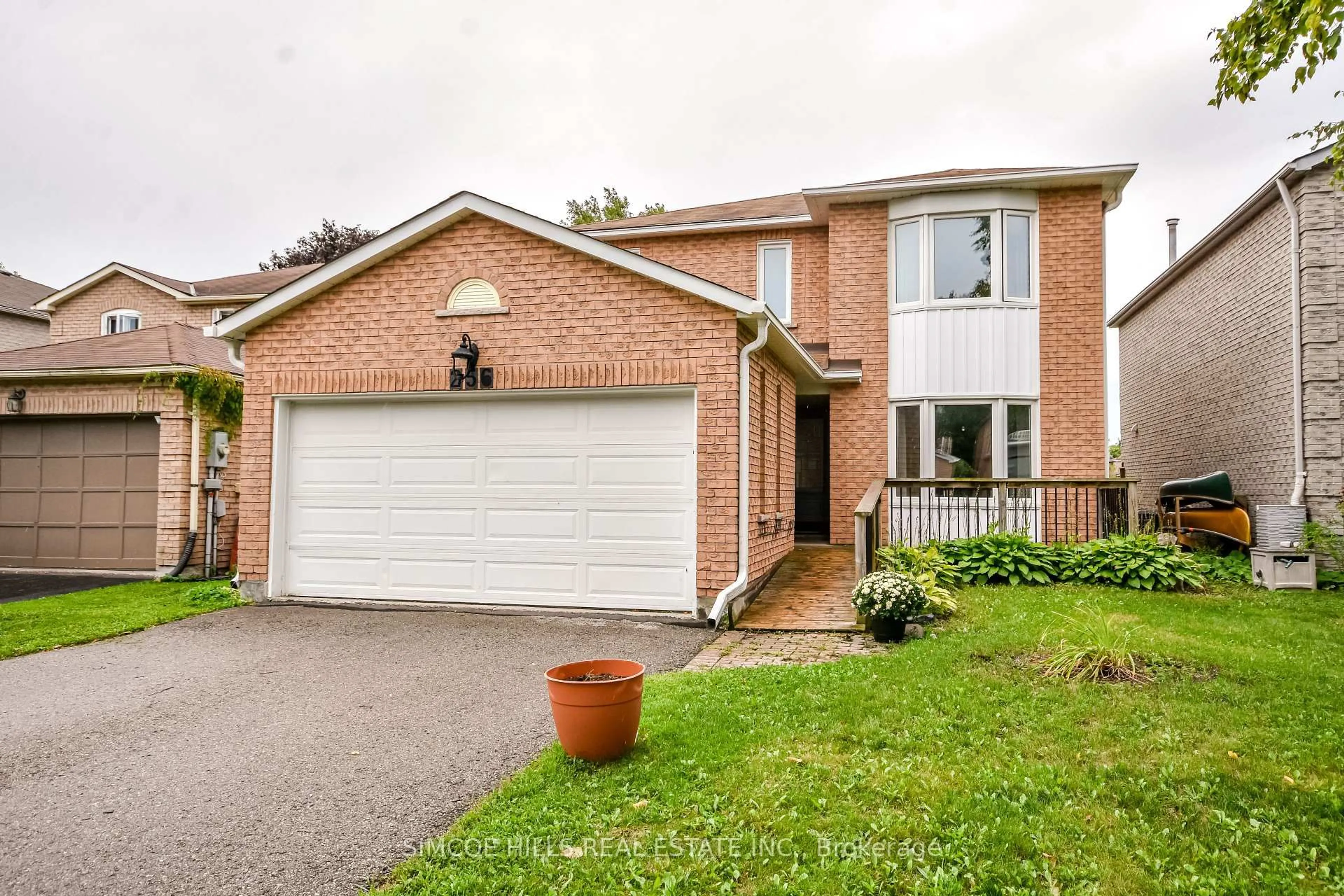 Home with brick exterior material, street for 256 Hickling Tr, Barrie Ontario L4M 5W7