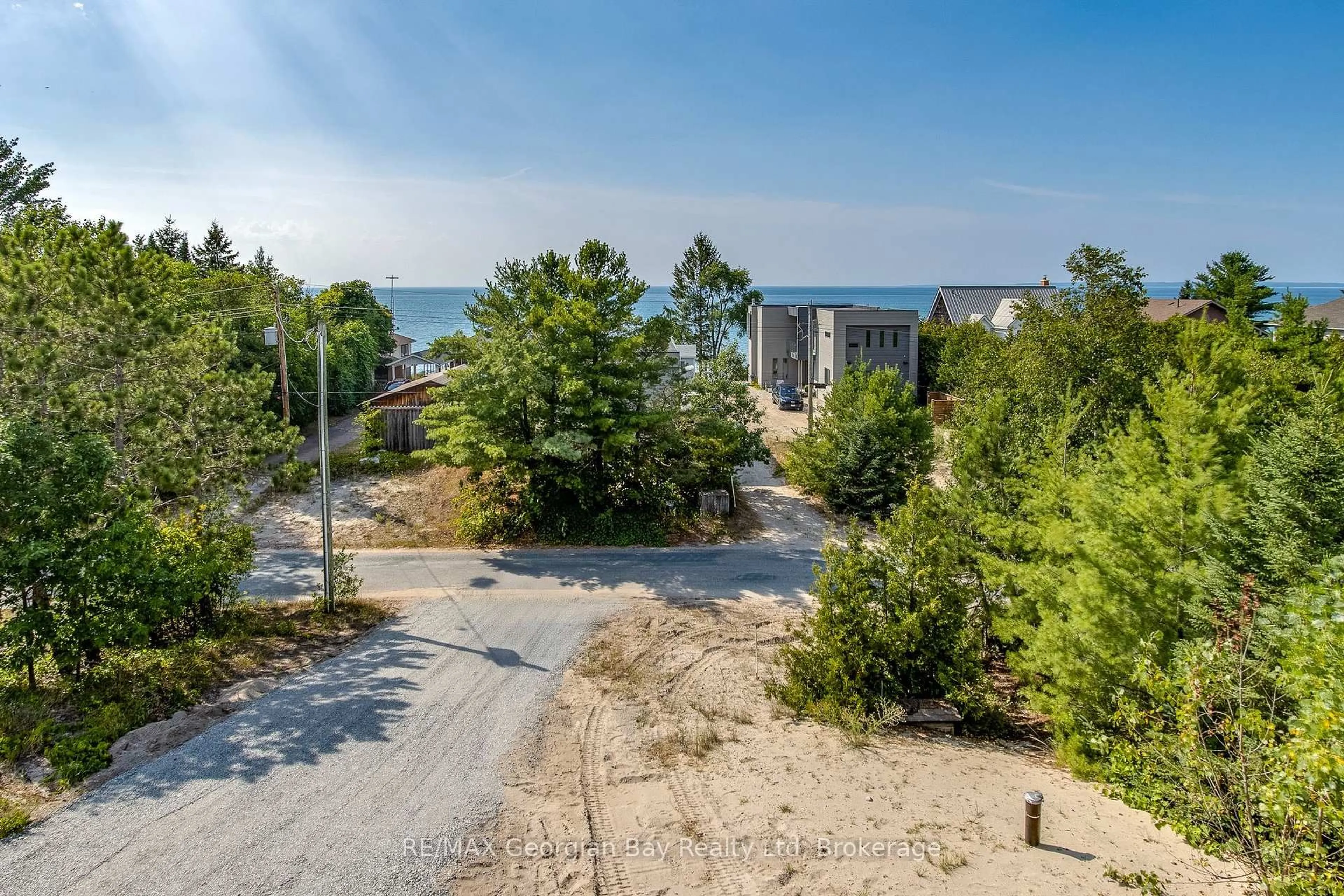 A pic from outside/outdoor area/front of a property/back of a property/a pic from drone, water/lake/river/ocean view for 23 Trew Ave, Tiny Ontario L0L 2T0