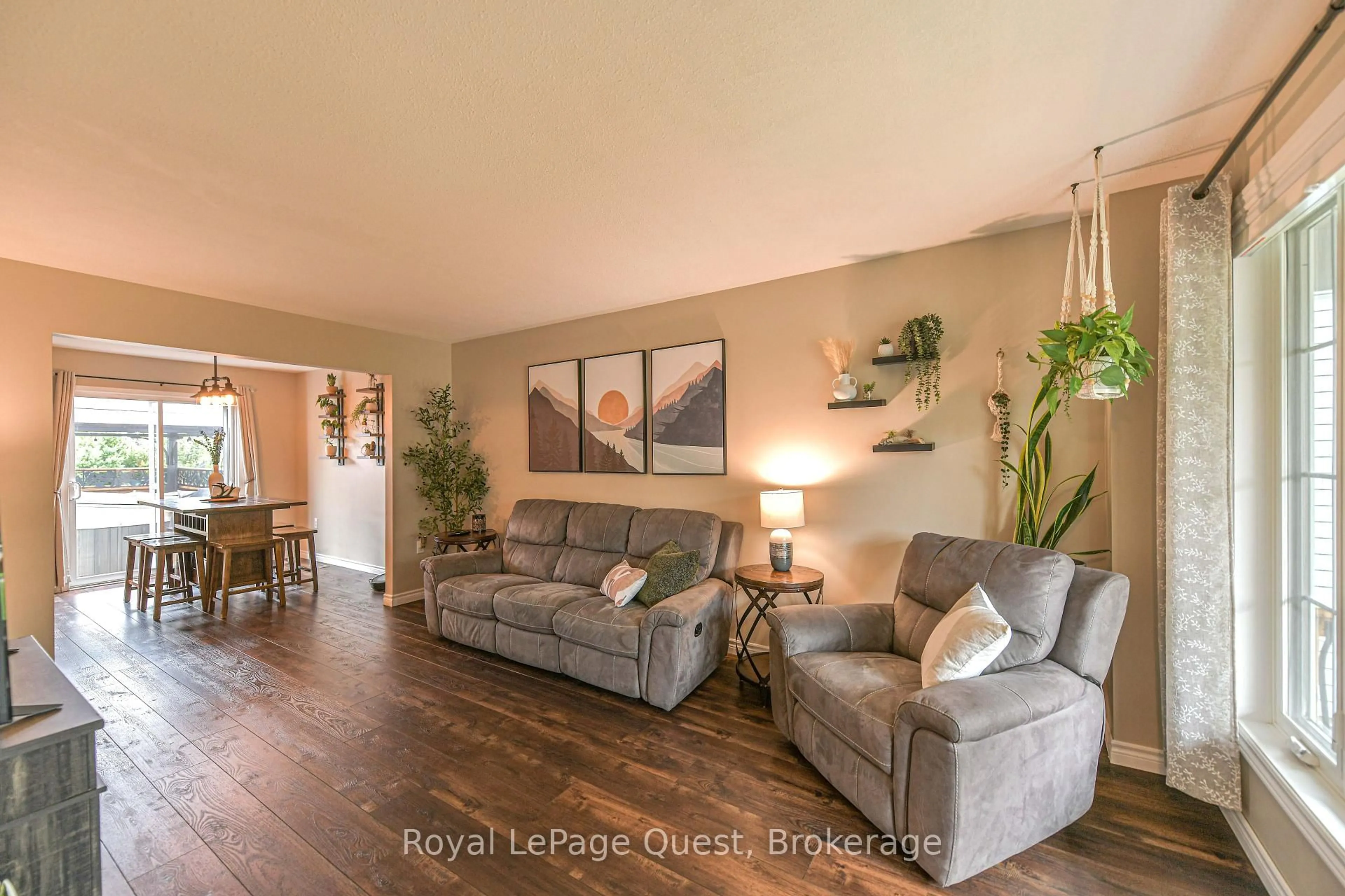 Living room with furniture, wood/laminate floor for 46 Courtney Cres, Orillia Ontario L3V 7Y3