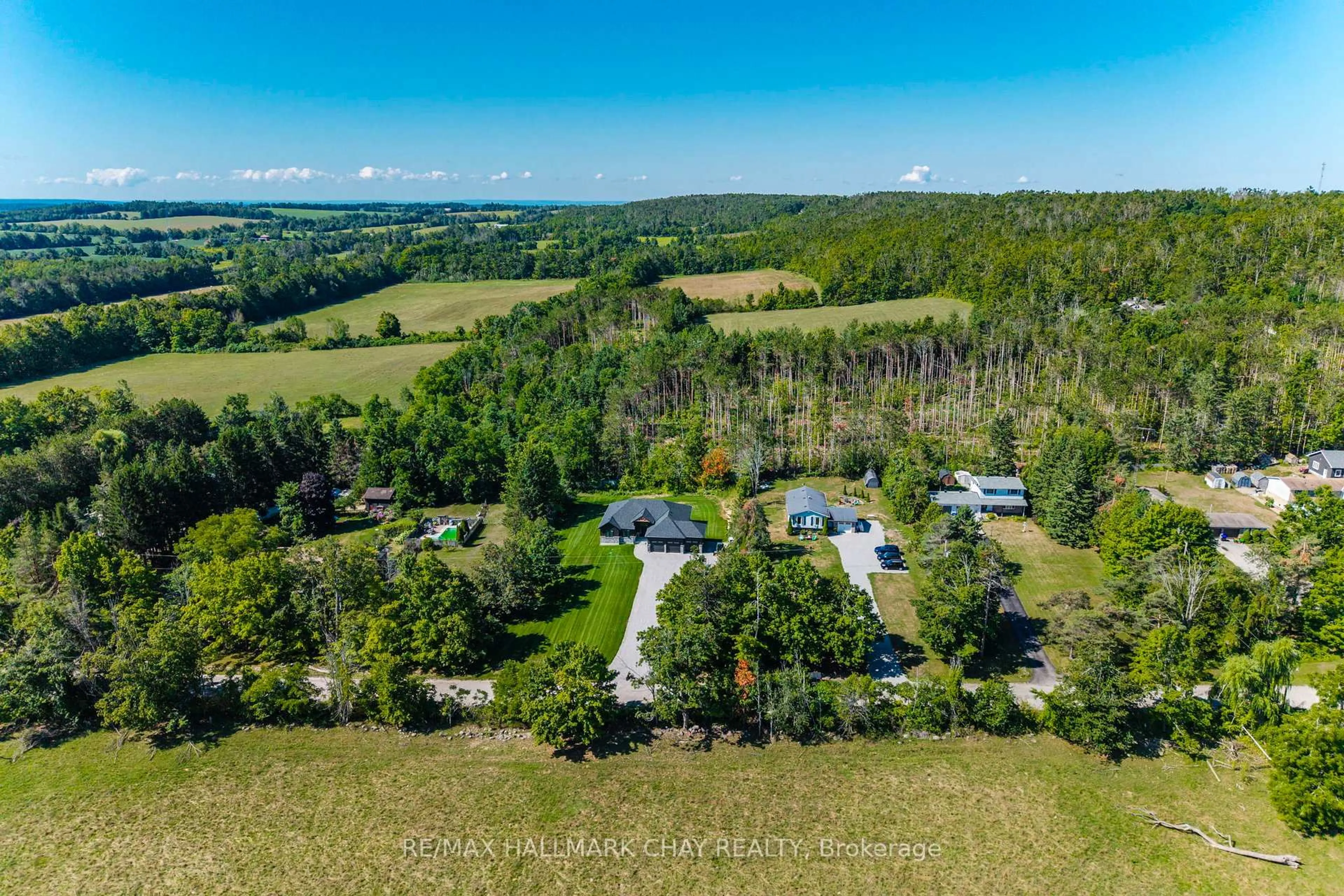 A pic from outside/outdoor area/front of a property/back of a property/a pic from drone, forest/trees view for 4552 5th Line, Oro-Medonte Ontario L0L 1V0