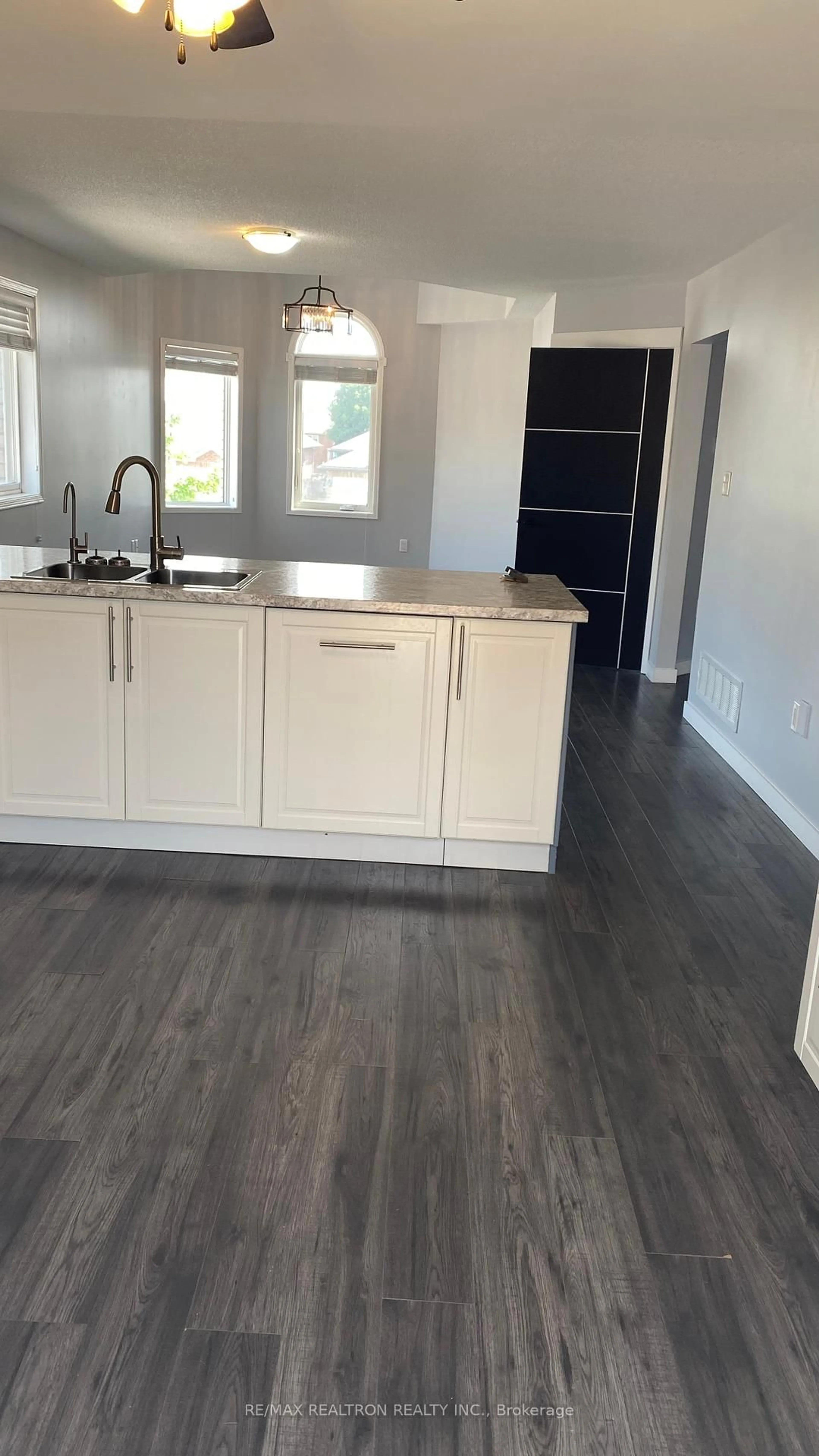 Open concept kitchen, wood/laminate floor for 210 Dunsmore Lane, Barrie Ontario L4M 6Z8