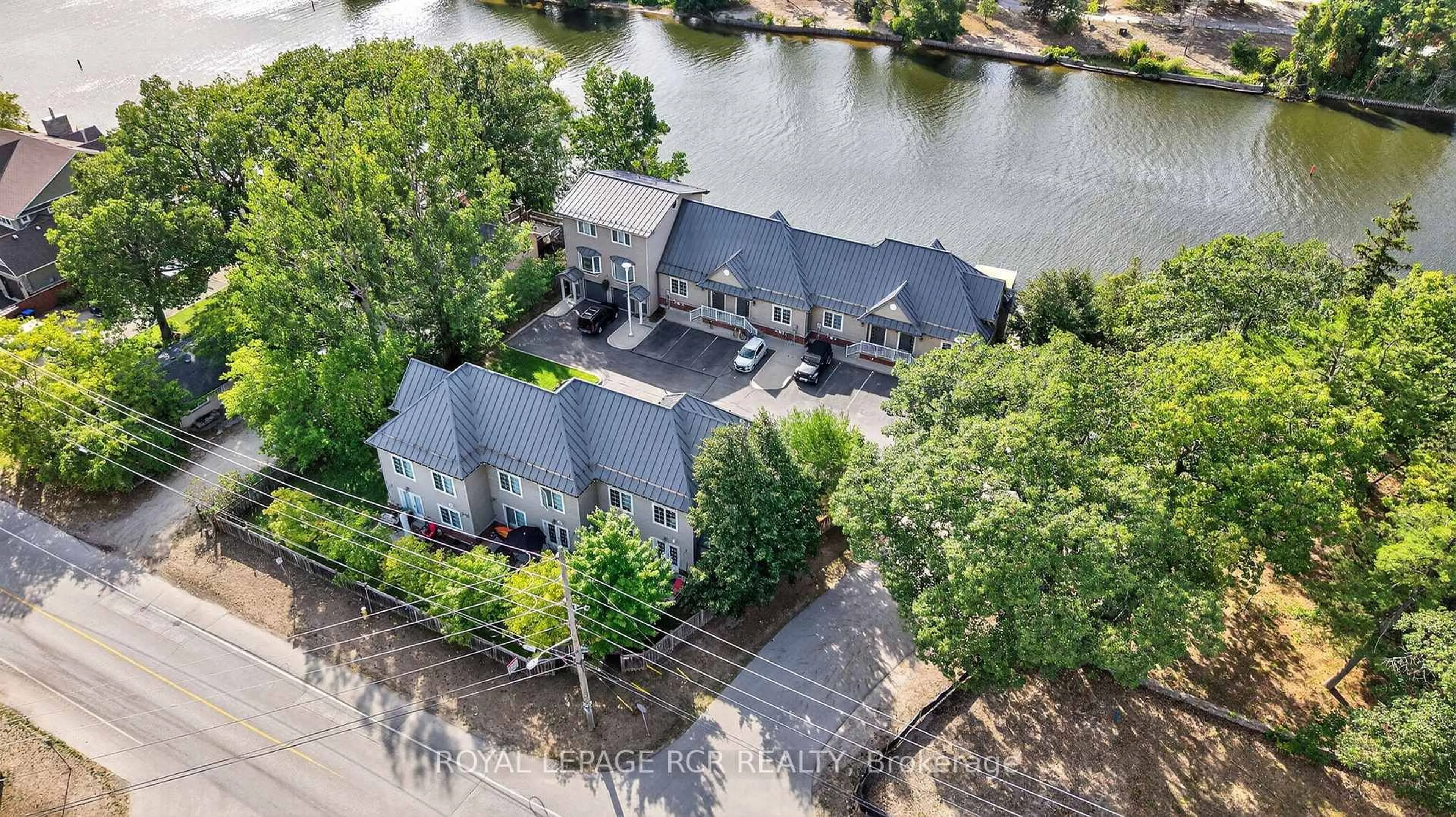 A pic from outside/outdoor area/front of a property/back of a property/a pic from drone, water/lake/river/ocean view for 64 River Rd #3, Wasaga Beach Ontario L9Z 2L1