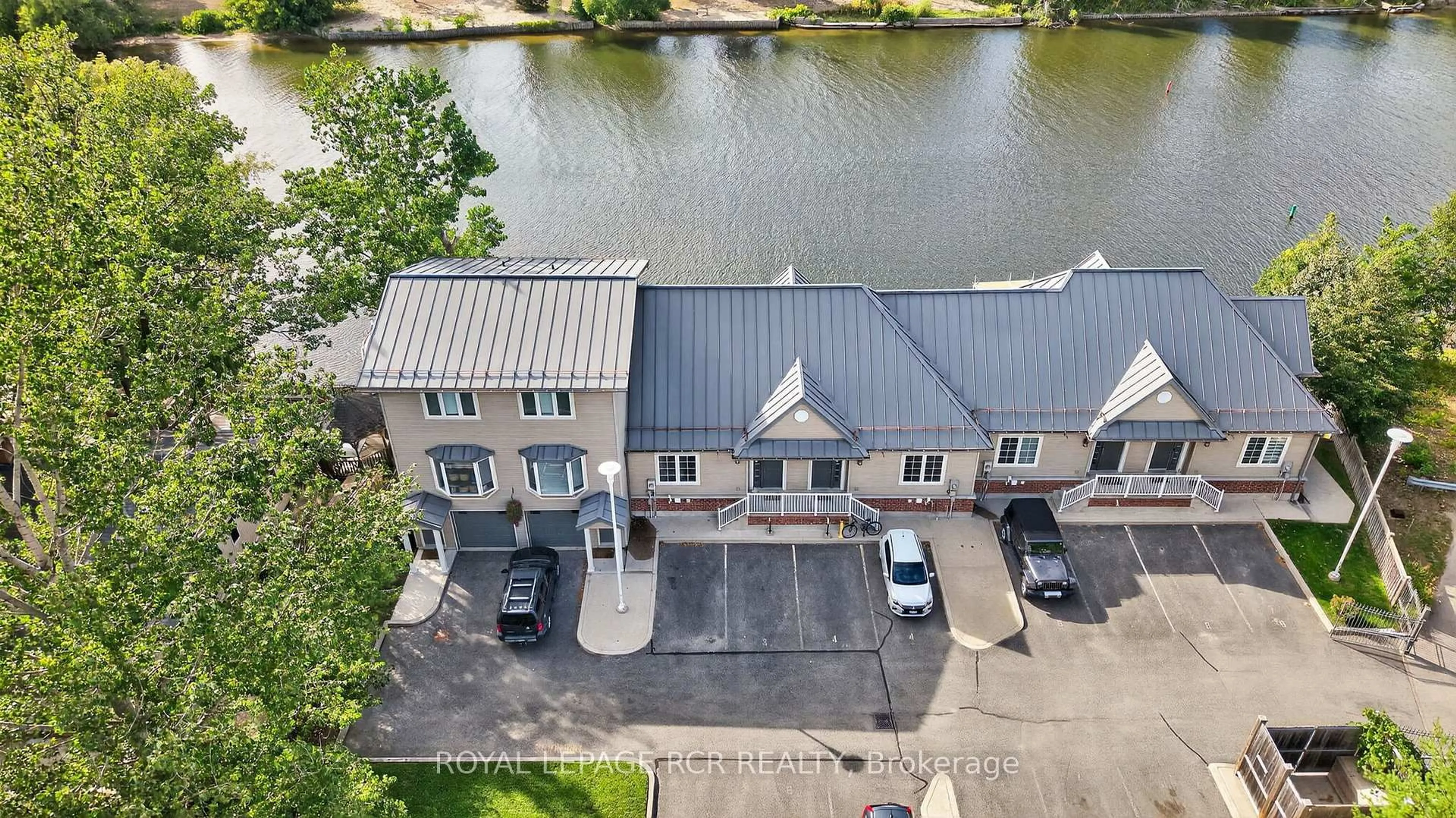 A pic from outside/outdoor area/front of a property/back of a property/a pic from drone, water/lake/river/ocean view for 64 River Rd #3, Wasaga Beach Ontario L9Z 2L1