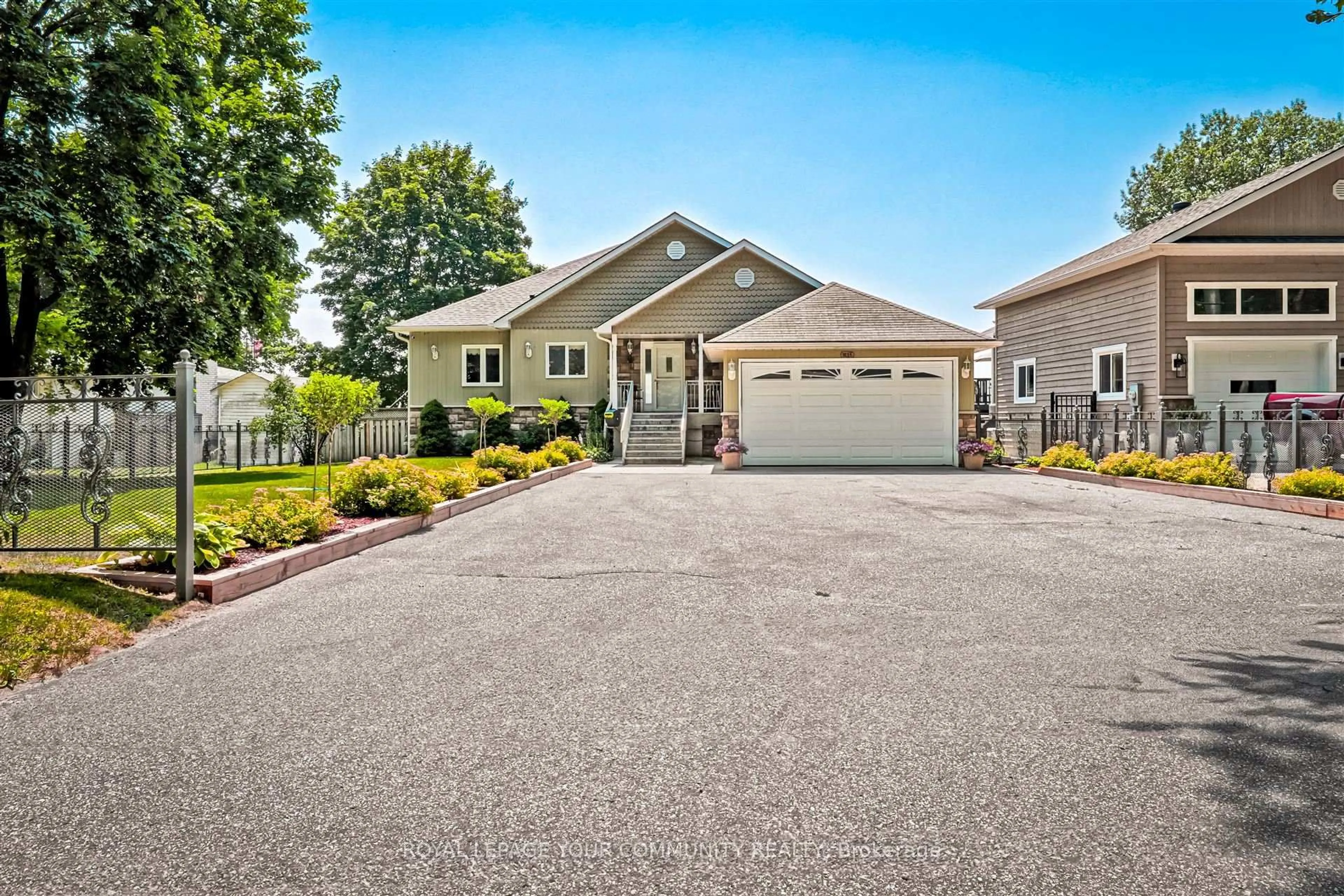 Home with vinyl exterior material, street for 1834 Tiny Beaches Rd, Tiny Ontario L0L 1P1