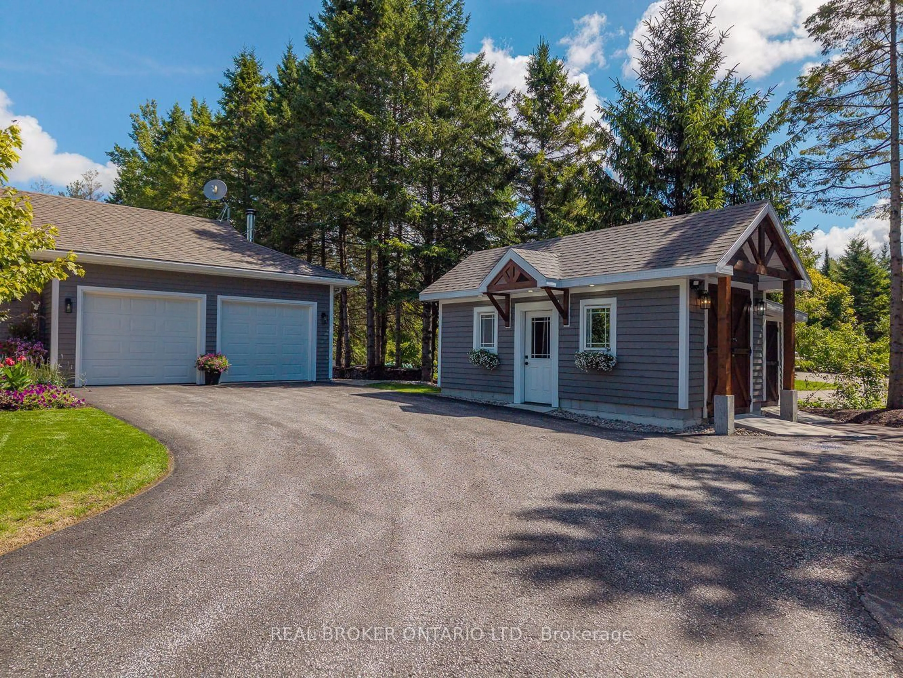 A pic from outside/outdoor area/front of a property/back of a property/a pic from drone, unknown for 8 Crystalwood Lane, Springwater Ontario L0L 1X0