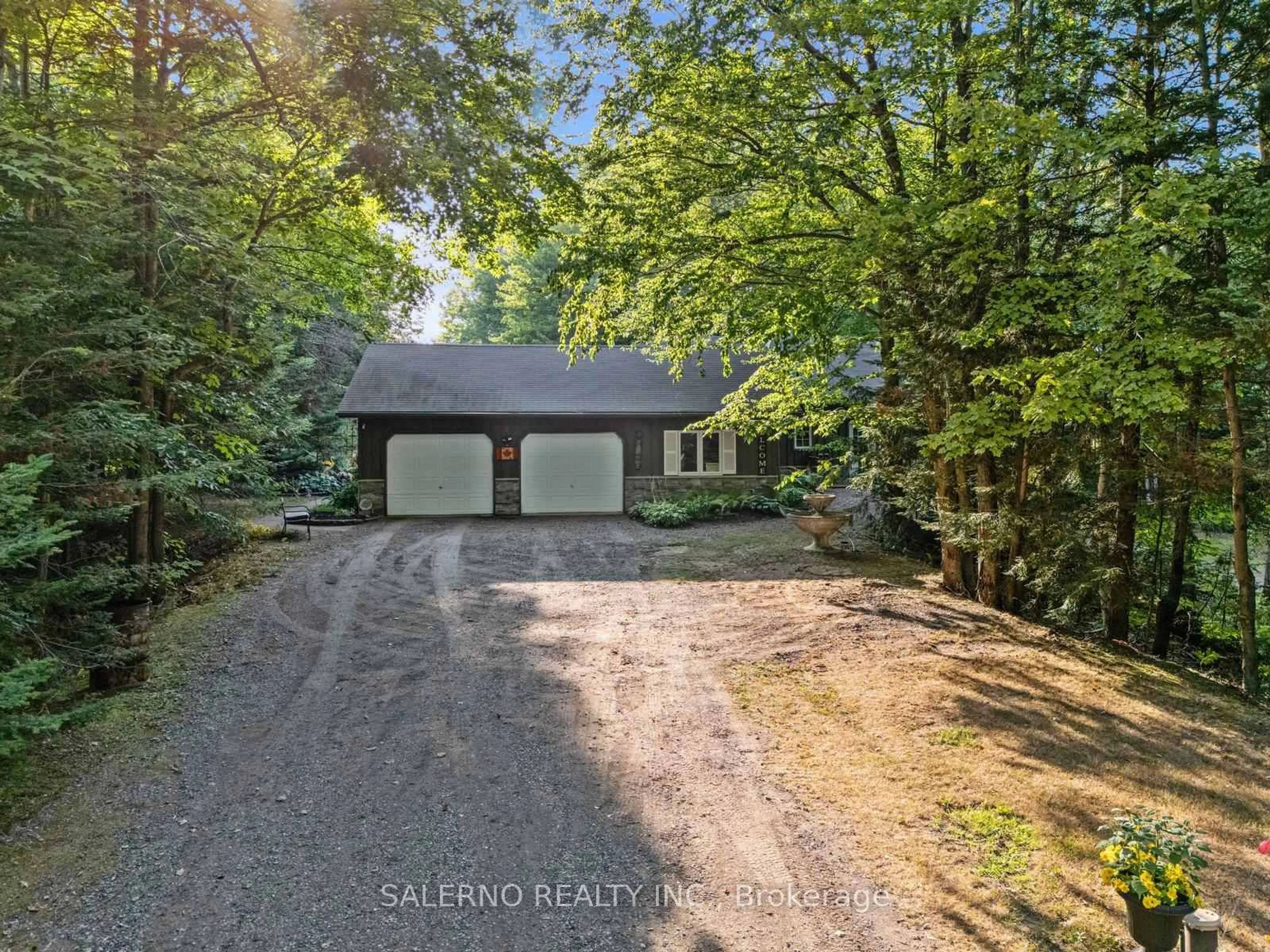 A pic from outside/outdoor area/front of a property/back of a property/a pic from drone, forest/trees view for 3992 Penetanguishene Rd, Springwater Ontario L0L 1V0