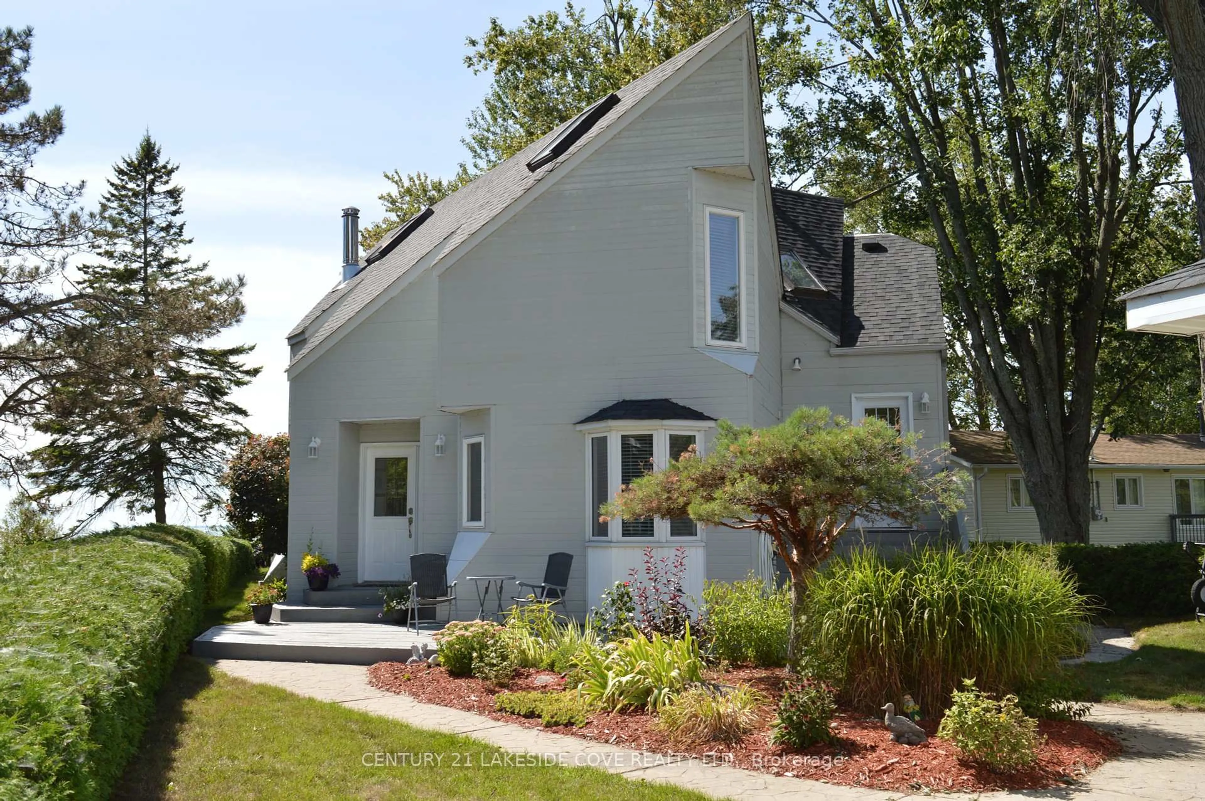 Home with vinyl exterior material, street for 100 Lake Ave, Ramara Ontario L0K 1B0