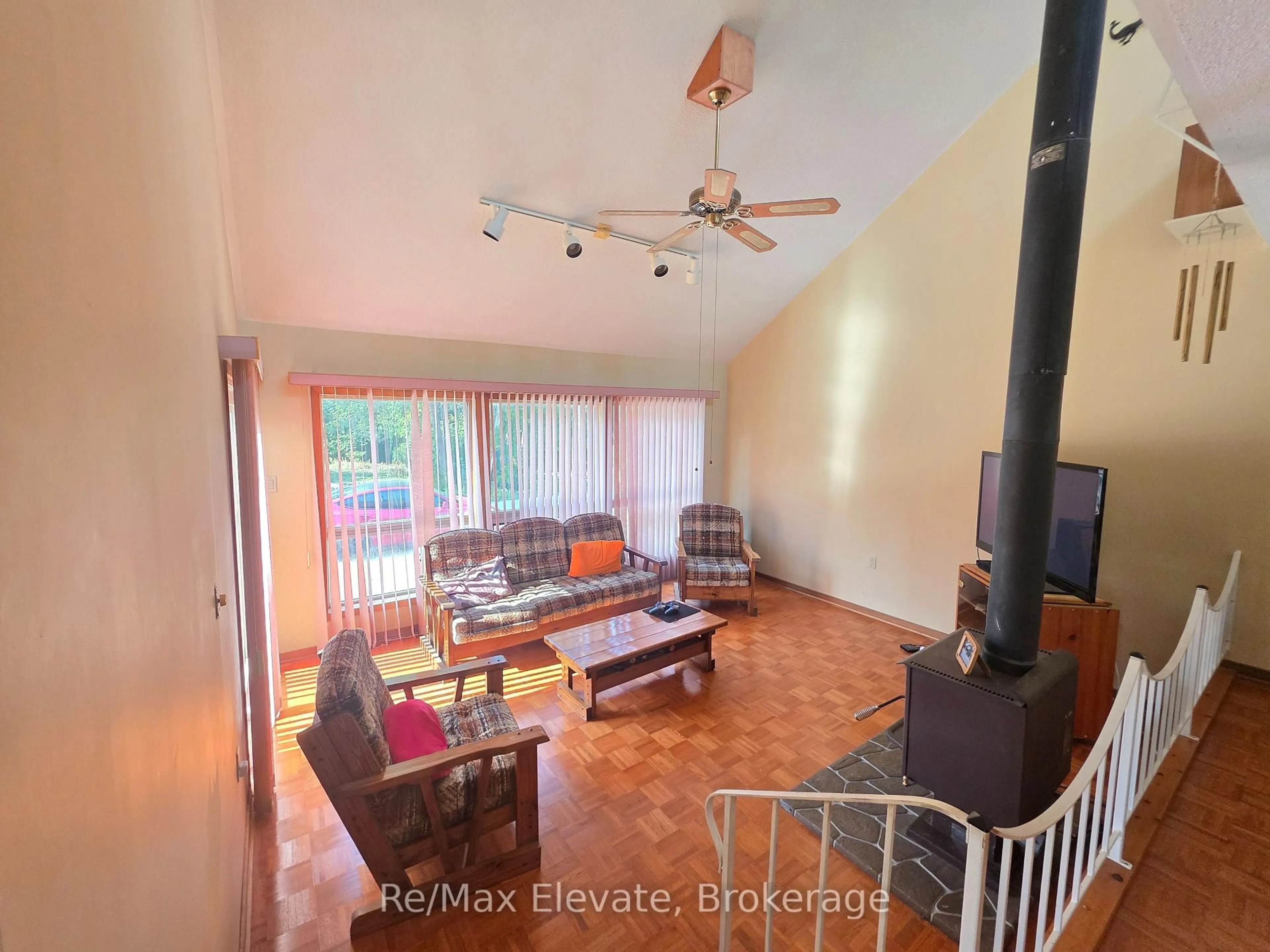 Living room with furniture, wood/laminate floor for 1679 Shore Lane, Wasaga Beach Ontario L9Z 1W4