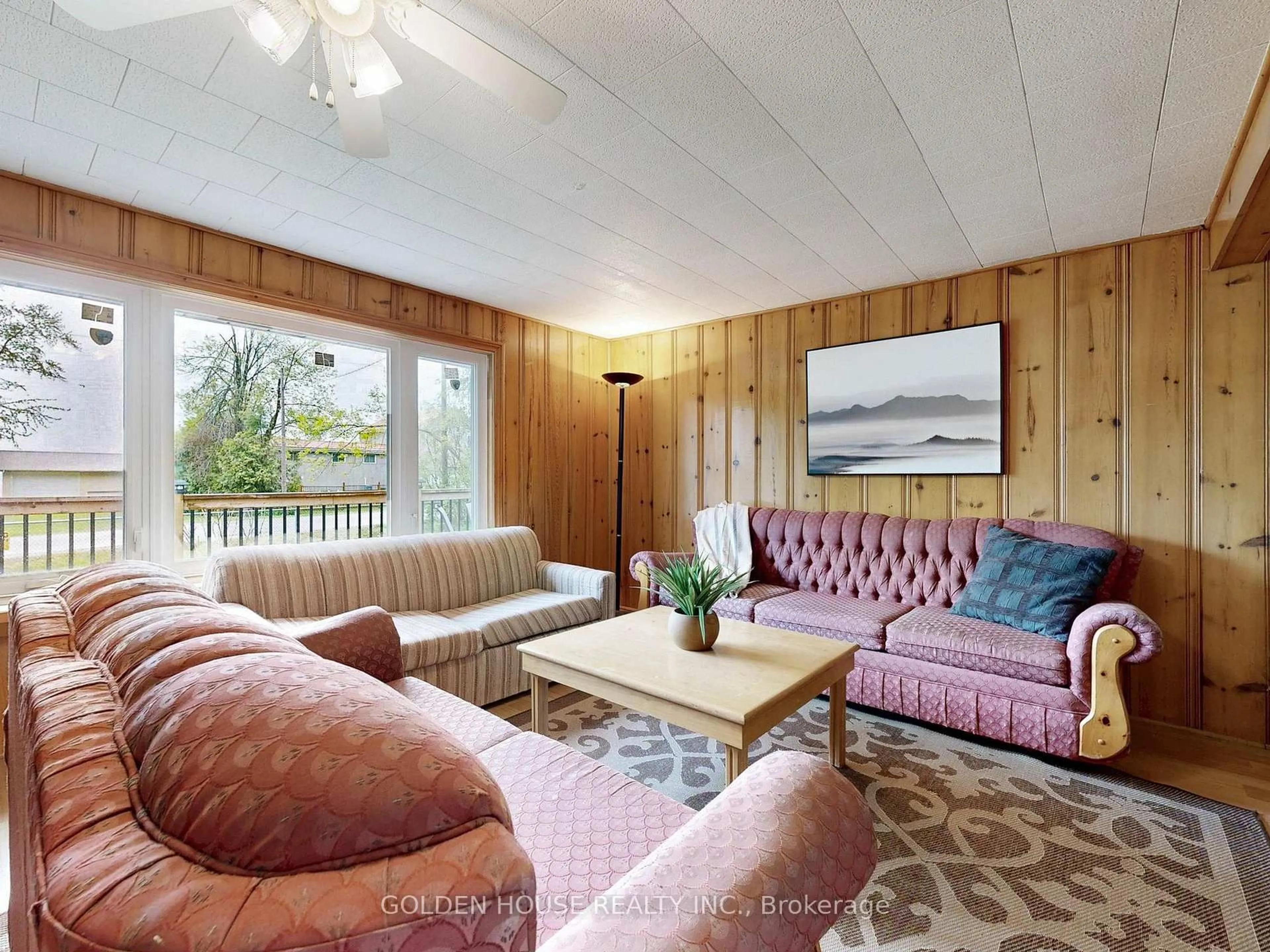 Living room with furniture, wood/laminate floor for 3845 Glenrest Dr, Ramara Ontario L0K 1B0