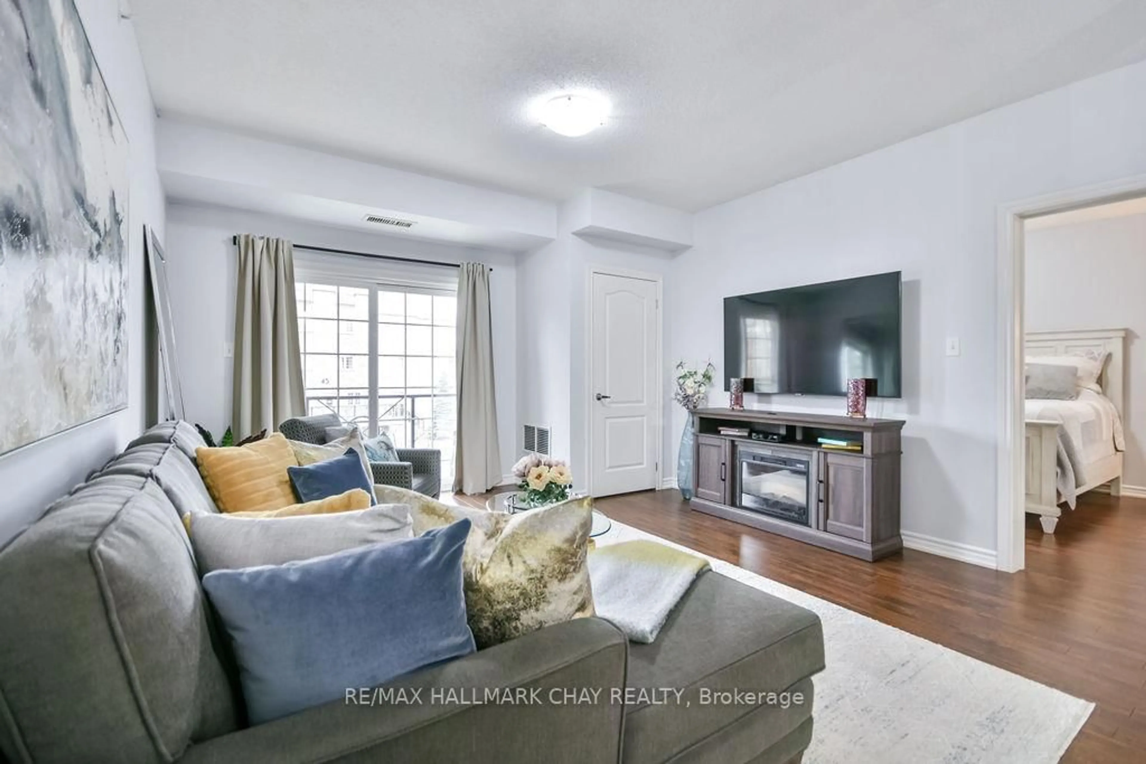 Living room with furniture, unknown for 43 Ferndale Dr #207, Barrie Ontario L4N 5W6