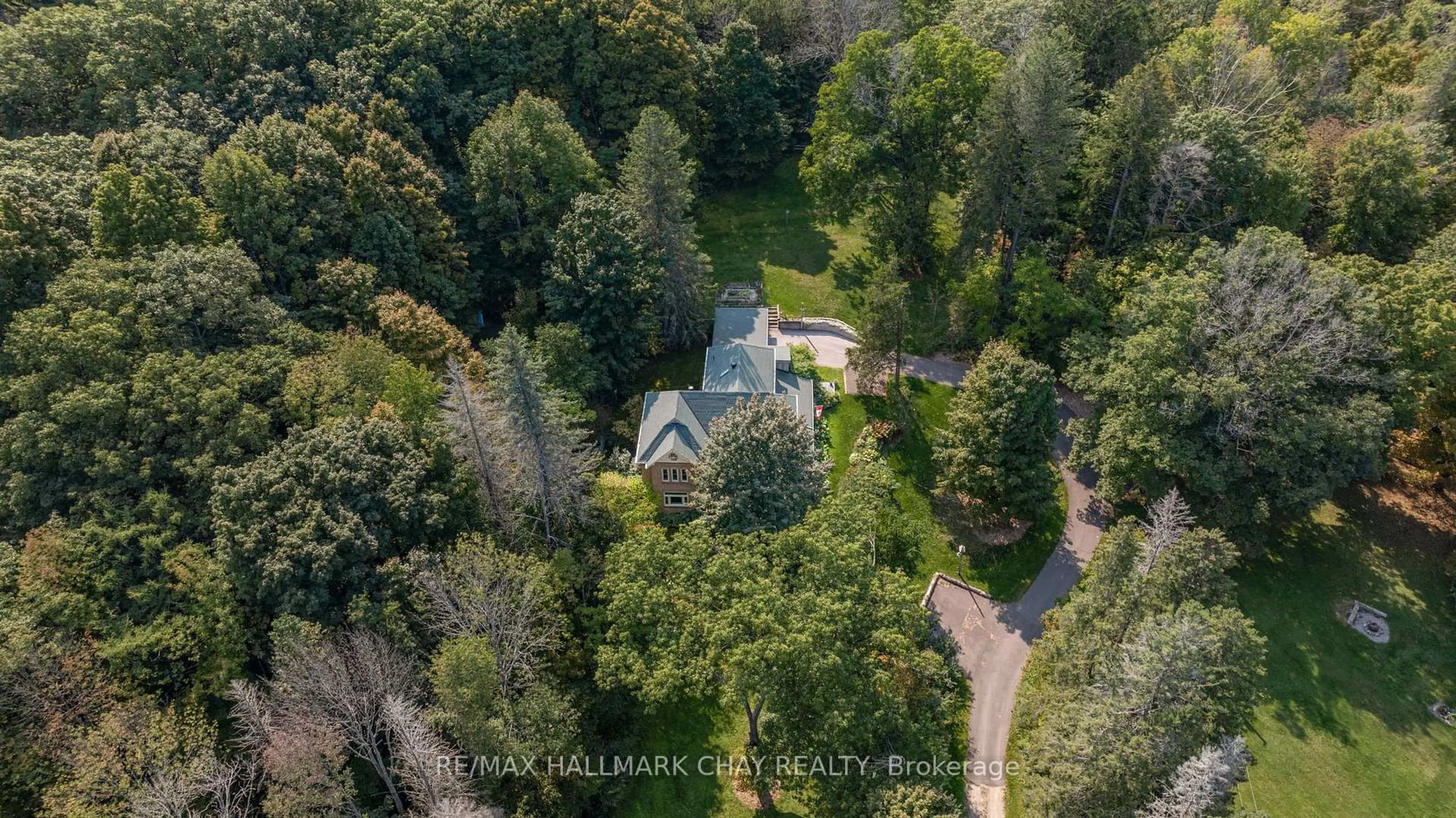 A pic from outside/outdoor area/front of a property/back of a property/a pic from drone, forest/trees view for 4950 Penetanguishene Rd, Springwater Ontario L0L 1V0