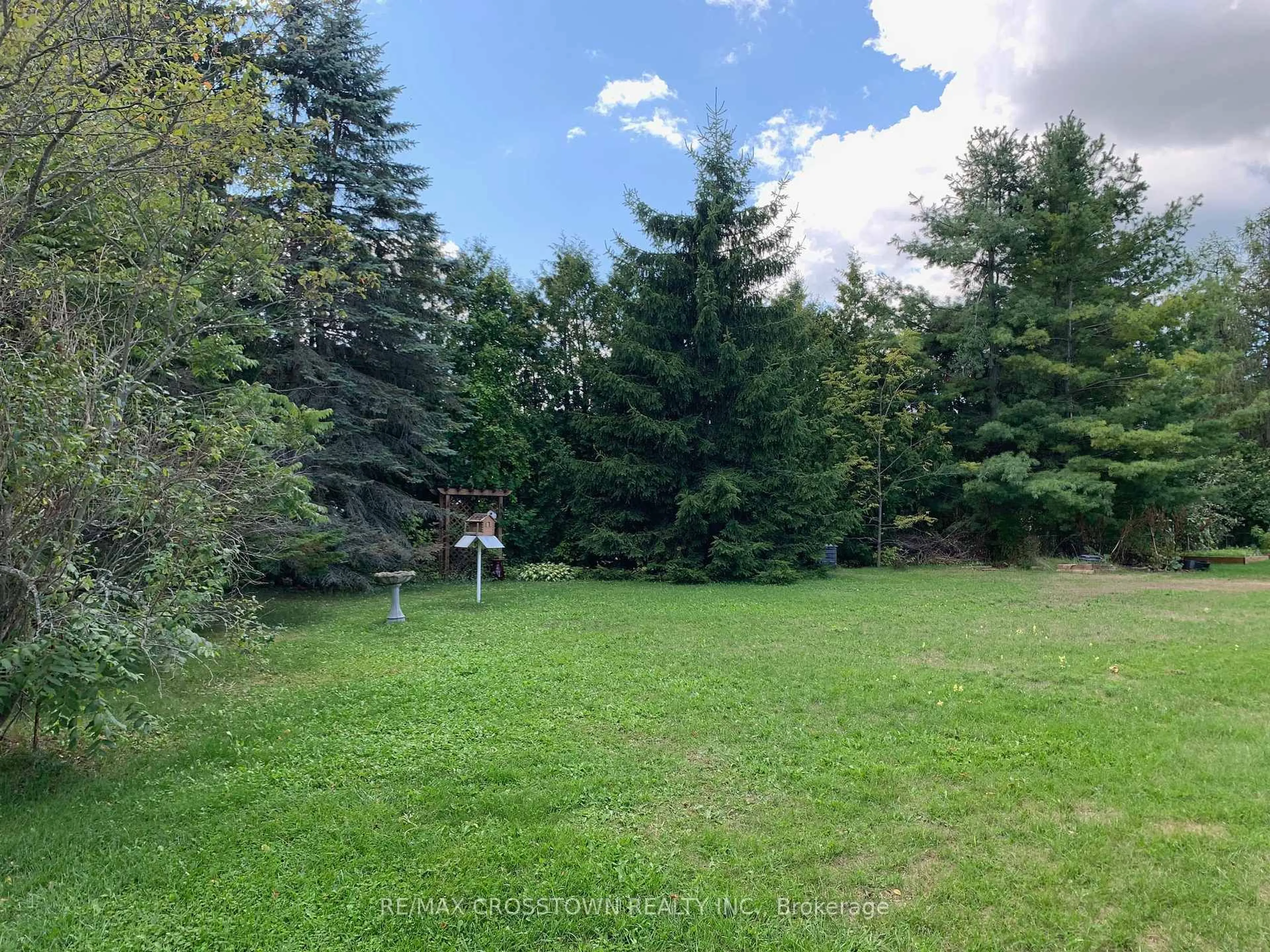 A pic from outside/outdoor area/front of a property/back of a property/a pic from drone, forest/trees view for 43 Foyston Park Circ, Springwater Ontario L0L 1Y0