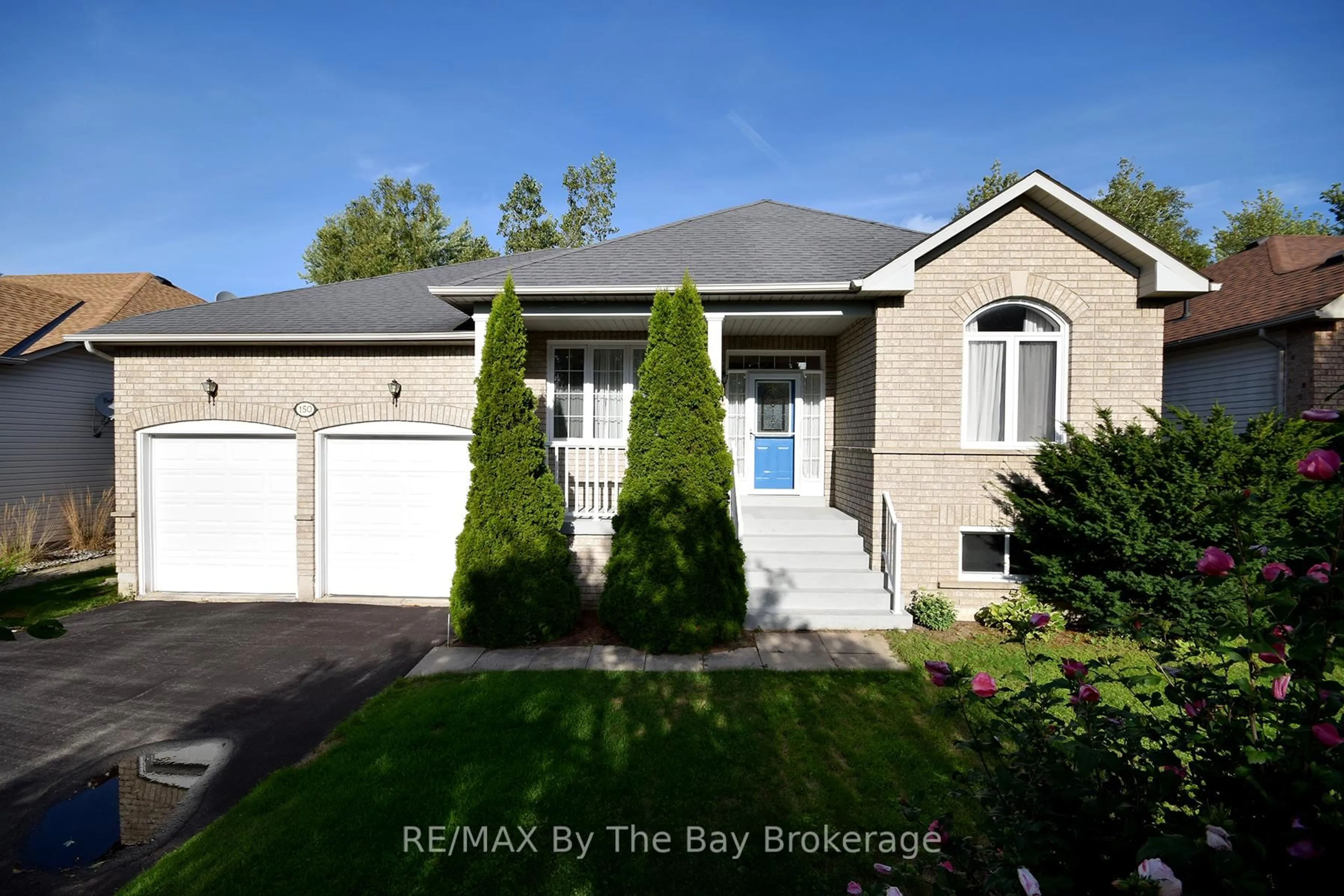Home with brick exterior material, street for 150 Silver Birch Ave, Wasaga Beach Ontario L9Z 1N3