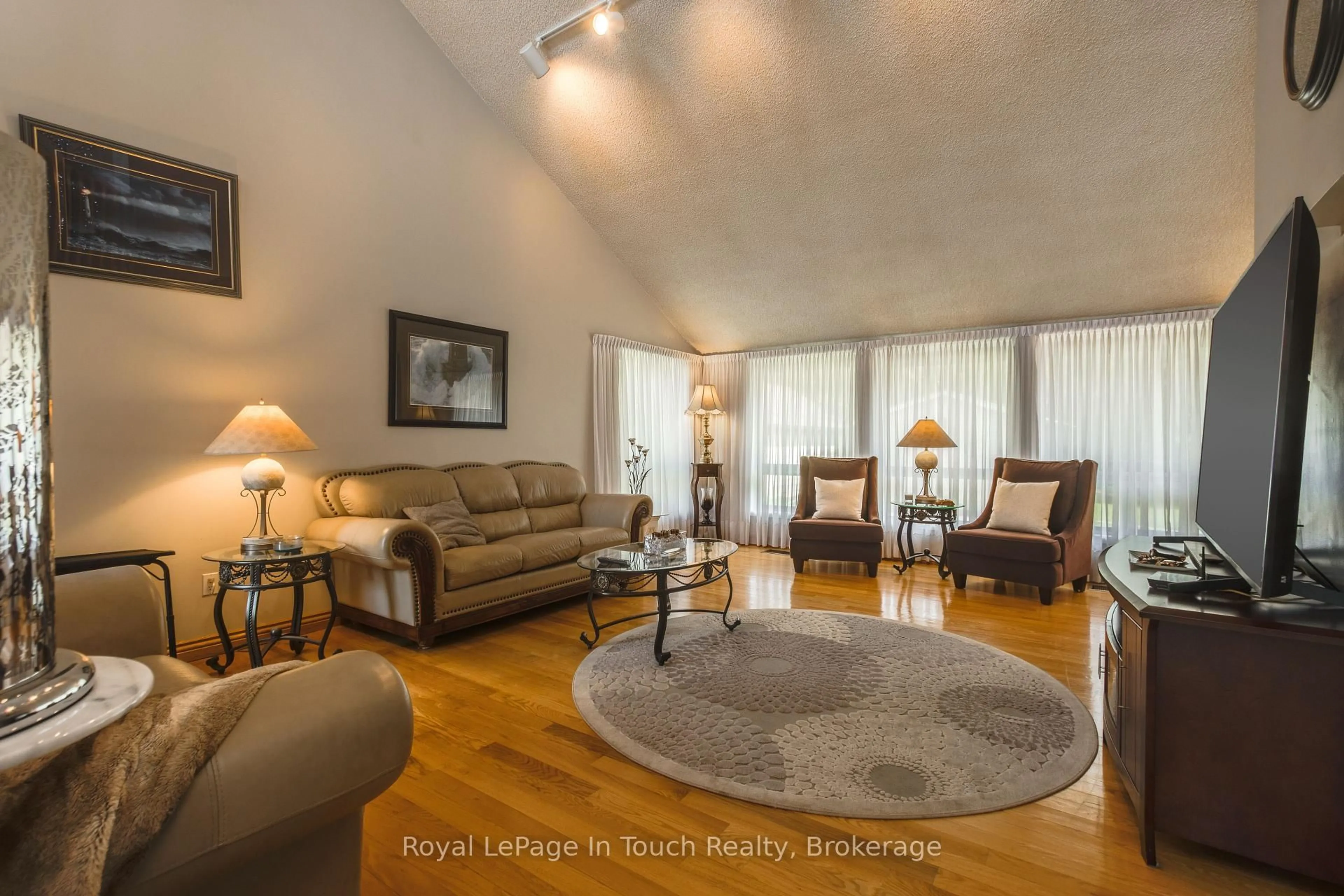 Living room with furniture, wood/laminate floor for 79 King Rd, Tay Ontario L0K 2C0