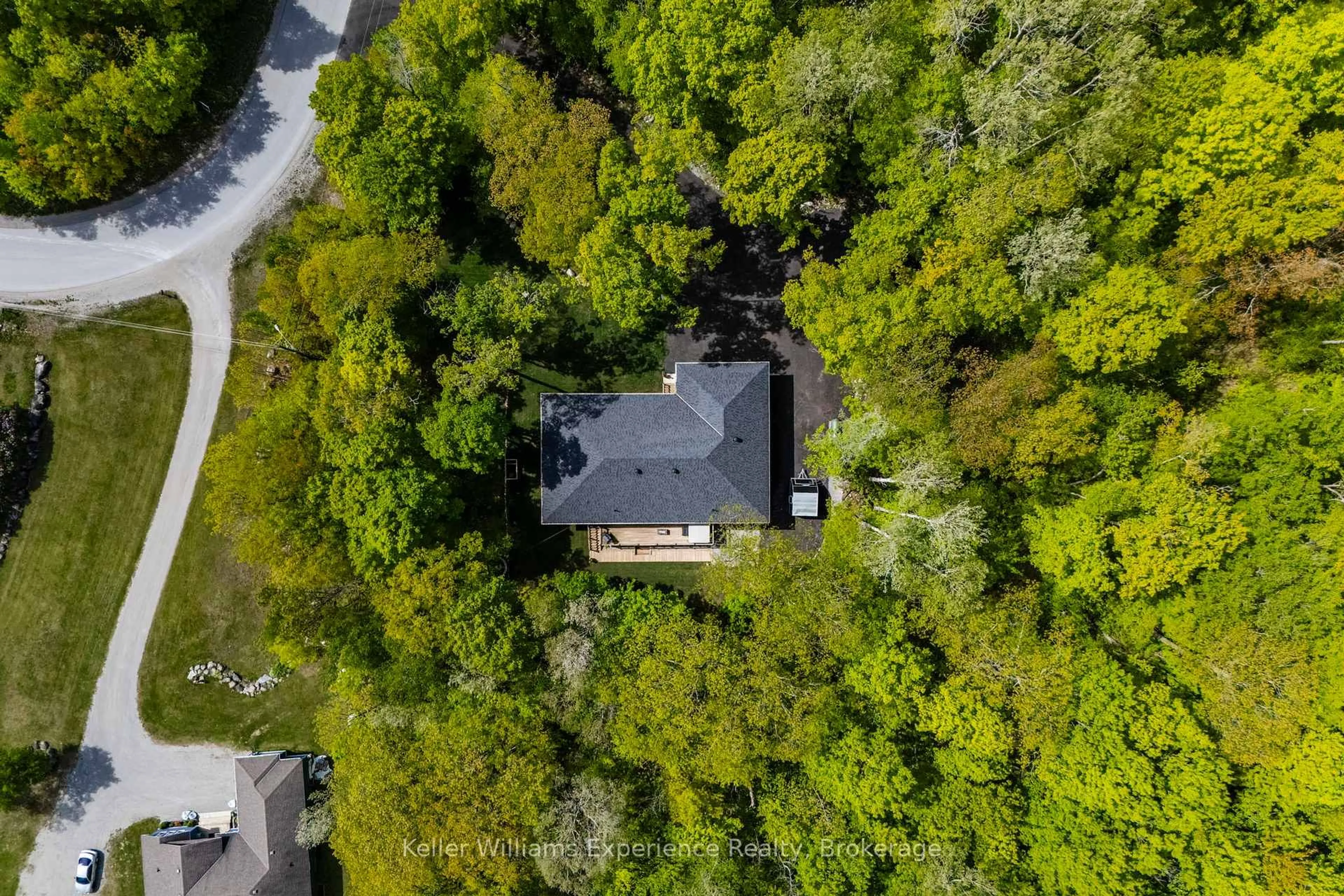 A pic from outside/outdoor area/front of a property/back of a property/a pic from drone, forest/trees view for 27 Meadows Ave, Tay Ontario L0K 1E0