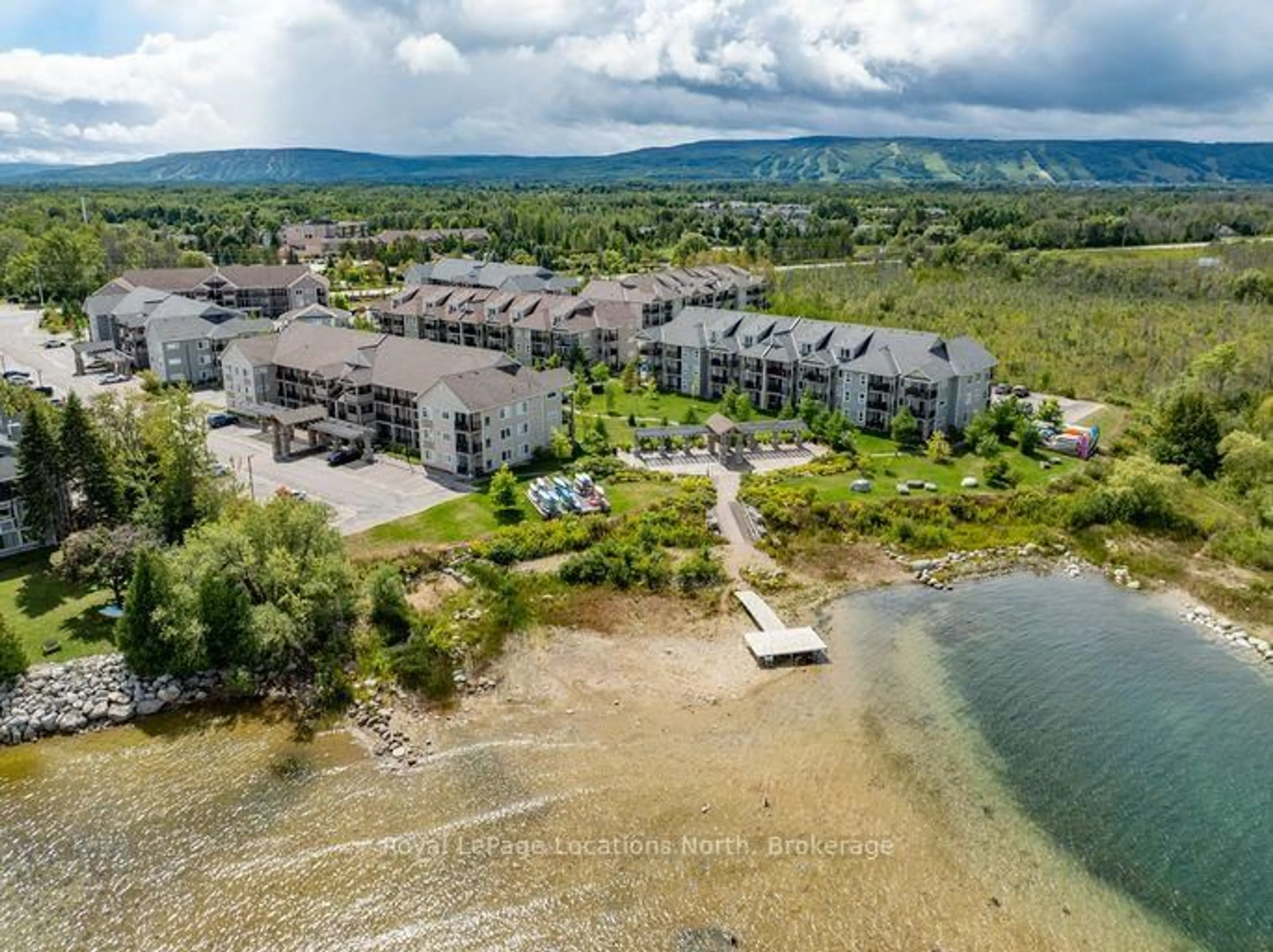 A pic from outside/outdoor area/front of a property/back of a property/a pic from drone, water/lake/river/ocean view for 4 Cove Crt #28, Collingwood Ontario L9Y 0Y6