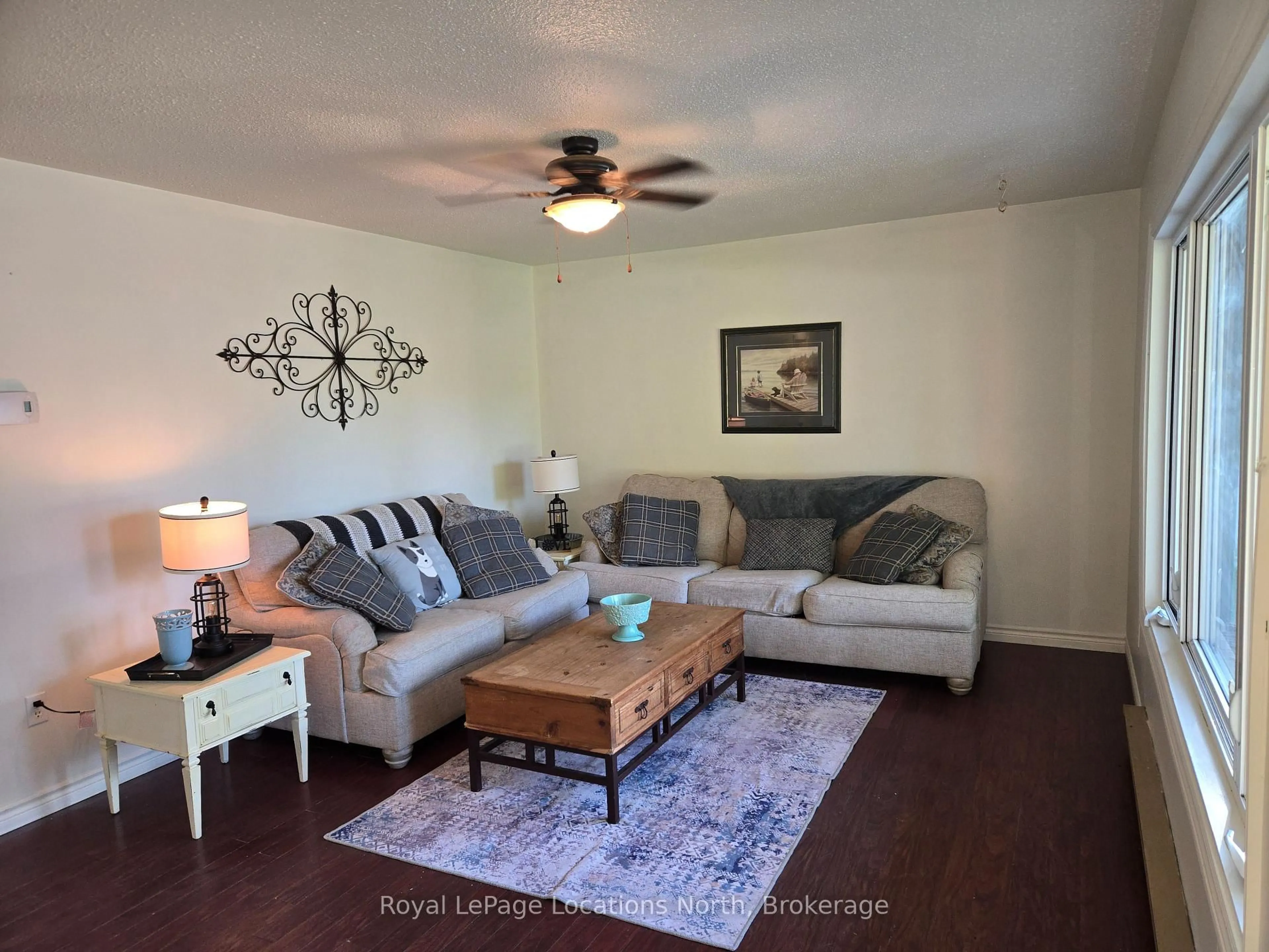 Living room with furniture, wood/laminate floor for 209 Christopher St, Clearview Ontario L0M 1S0