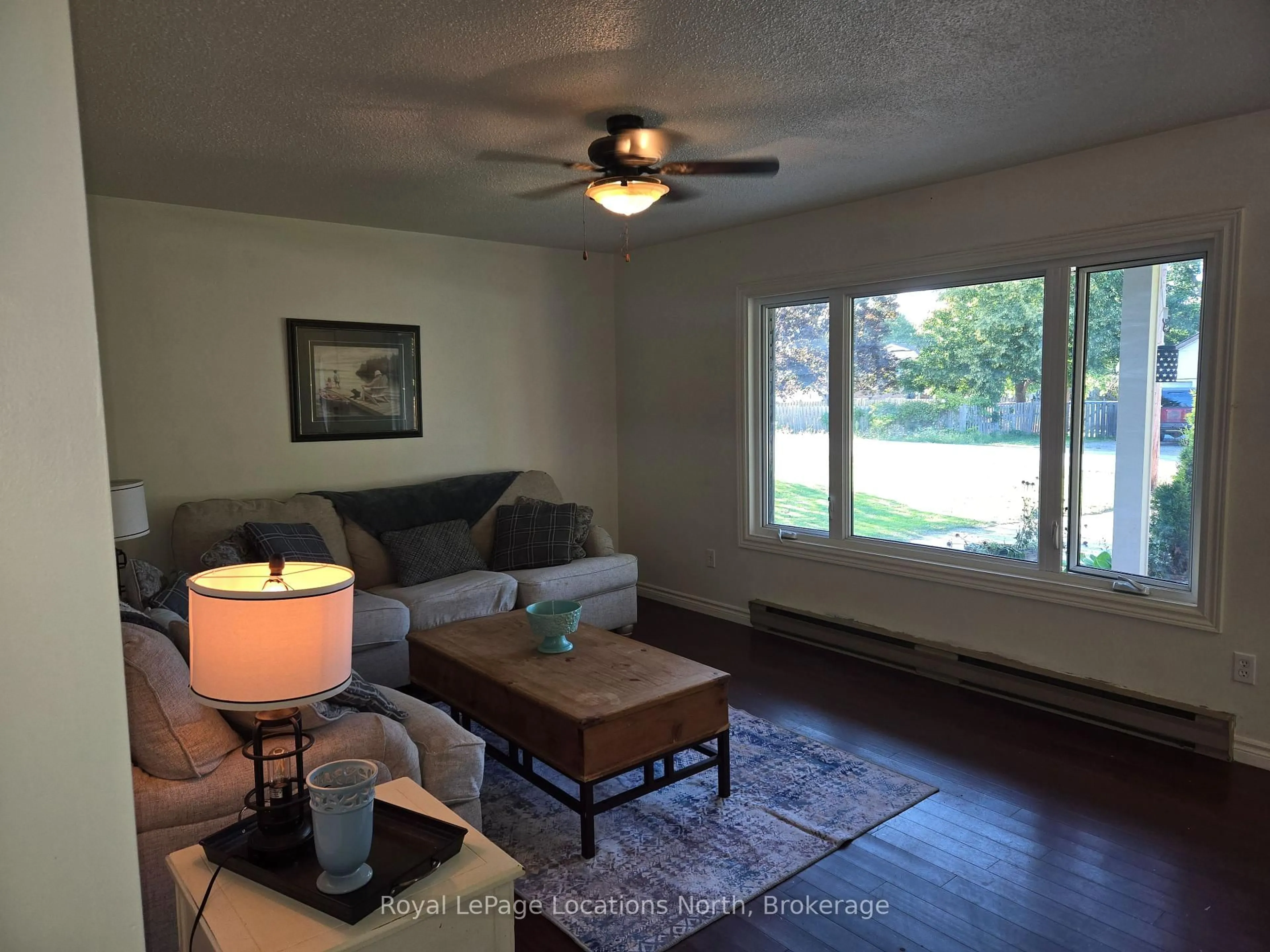 Living room with furniture, wood/laminate floor for 209 Christopher St, Clearview Ontario L0M 1S0