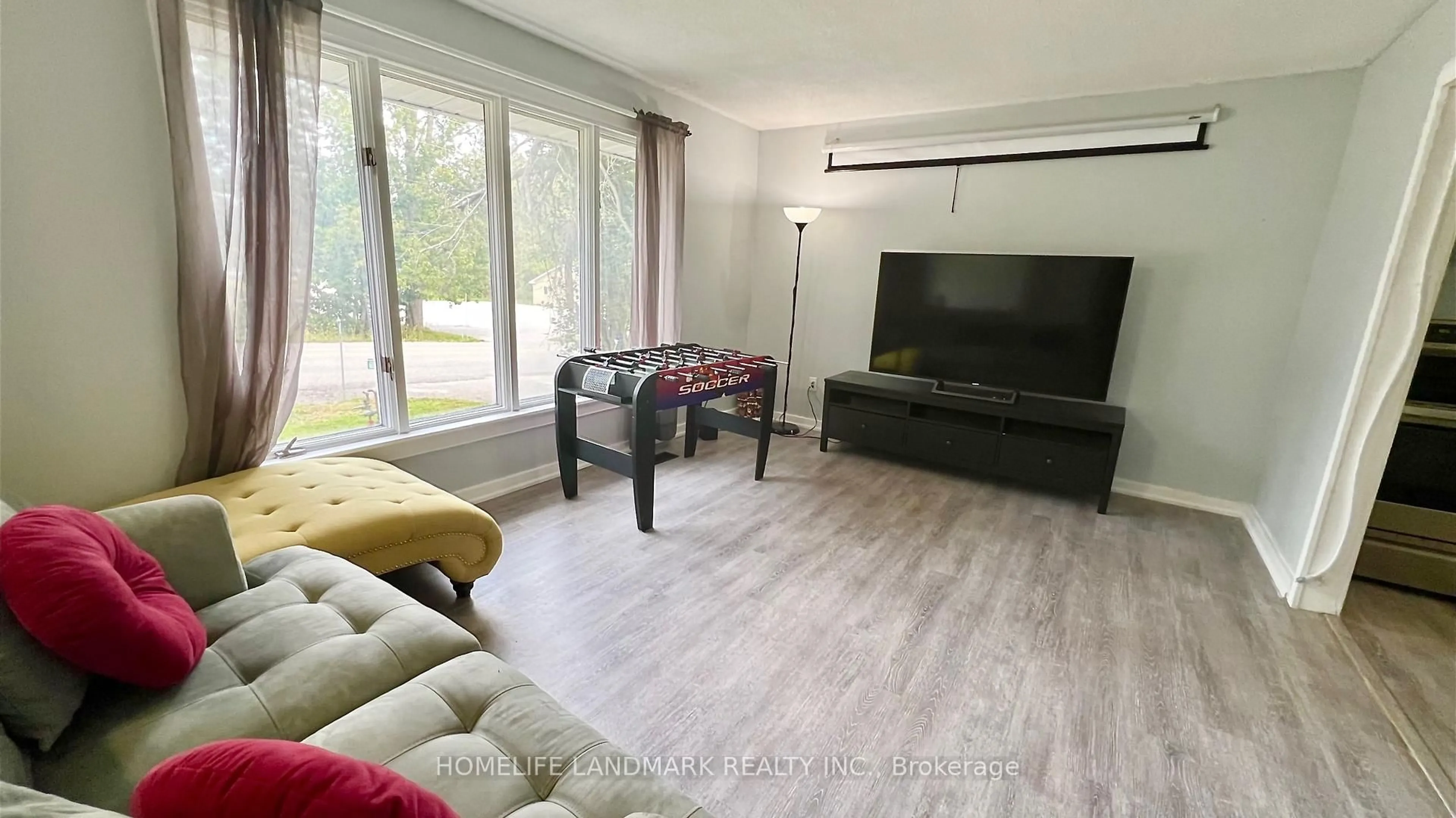 Living room with furniture, wood/laminate floor for 688 7th Line, Oro-Medonte Ontario L0L 2E0