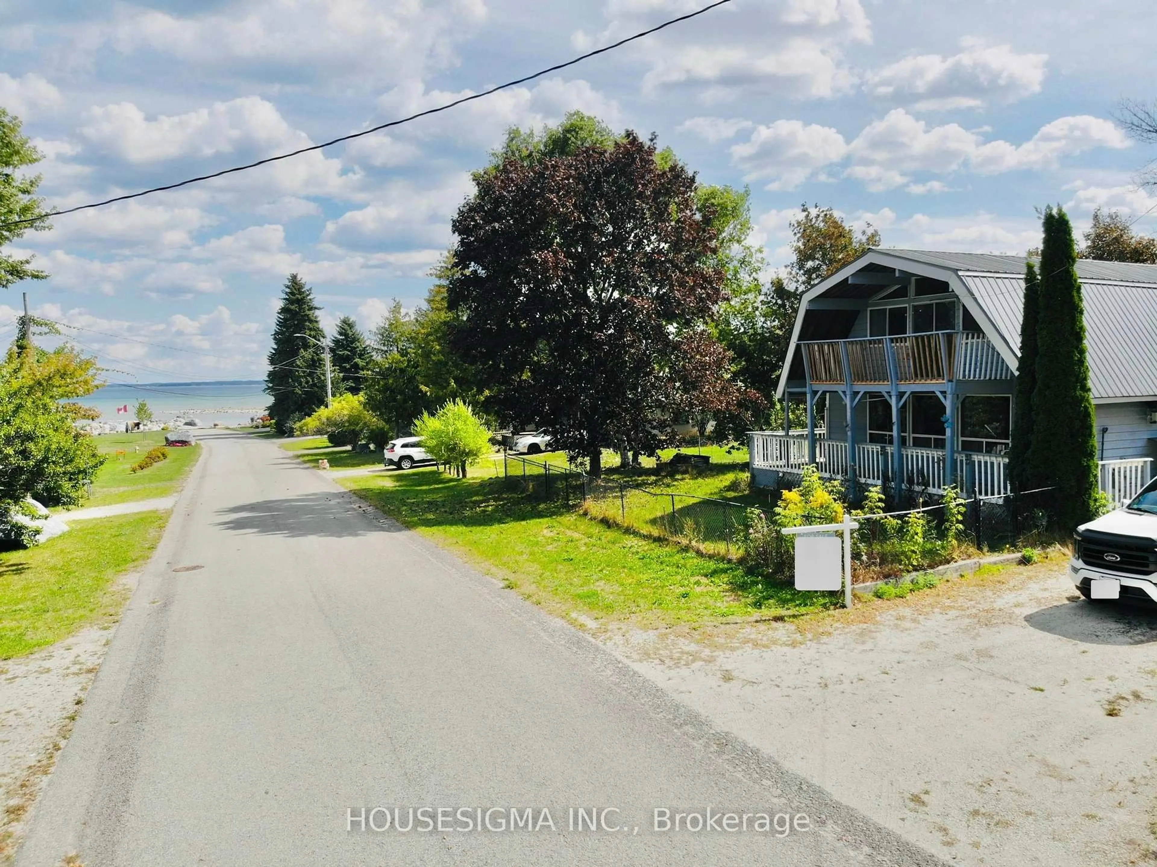 A pic from outside/outdoor area/front of a property/back of a property/a pic from drone, water/lake/river/ocean view for 13 Bayview Ave, Wasaga Beach Ontario L9Z 2Y6