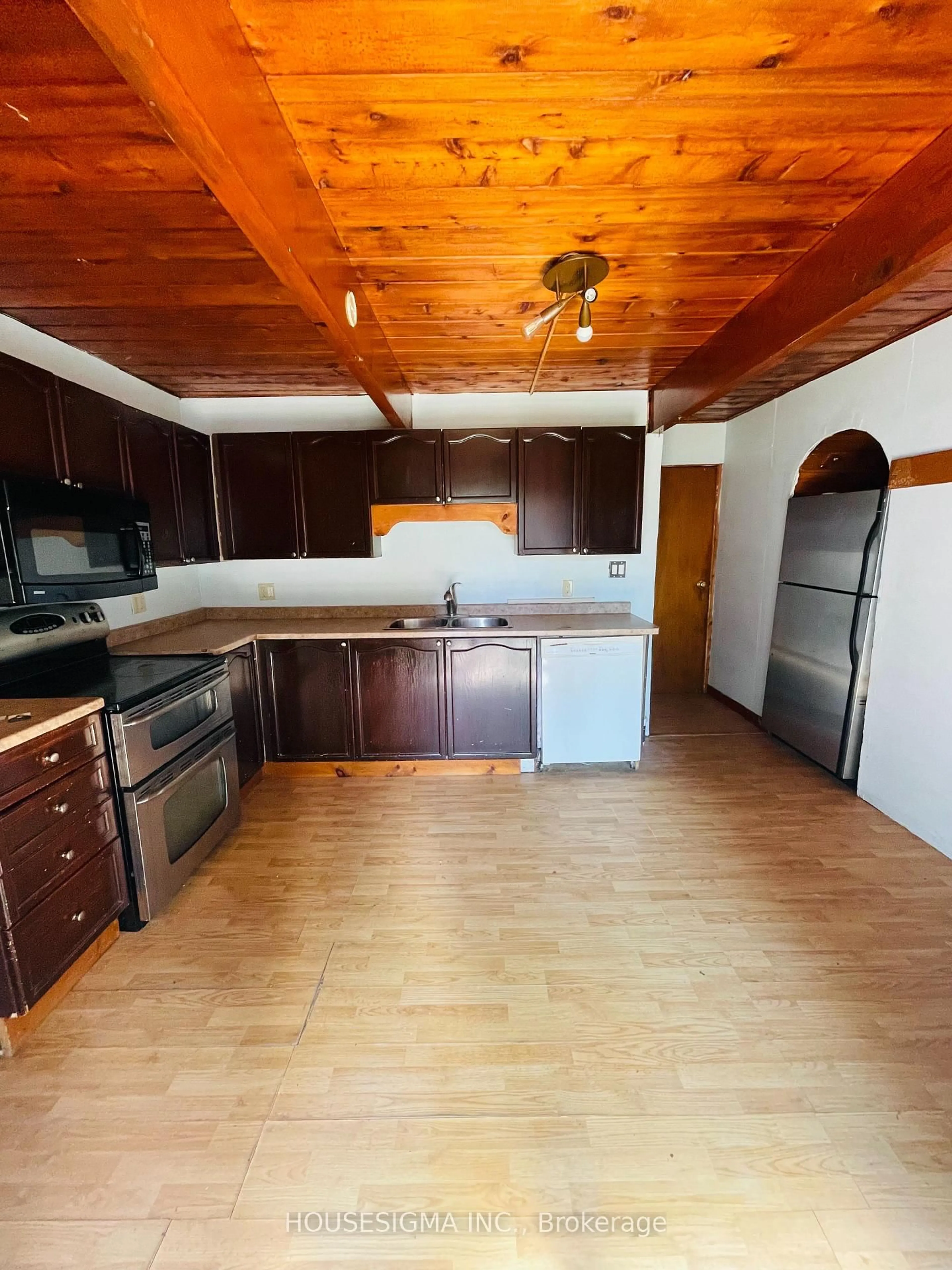 Open concept kitchen, wood/laminate floor for 13 Bayview Ave, Wasaga Beach Ontario L9Z 2Y6